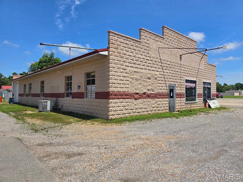 Are you searching for a highly visible property for your business?  This property is on Business Highway 60 and has a high traffic count day and night!  This sale includes all the paved area and 3 buildings.  Building 1:  Repair Shop is 4500 square feet.  This building has a front "office" area and a large open bay area with concrete floors and multiple garage doors.  This is currently being used as a mechanic shop.  Building 2:  Office with 456 square feet.  This includes an open entry area and a separate office area.  Building 3:  Repair Shop/Wash Bay with 1800 square feet.  This building has a concrete floor, a wash bay area with a drain currently used to wash vehicles, and an office area.   The potential is real with this property.  You can use one building for yourself and rent the others or keep them for your own business or even multiple businesses.  The "grass area" is not included but you may have first option to purchase at a later date.  You need to see this property to see the vision for your future!  Call today to start your dream of owning your own business.