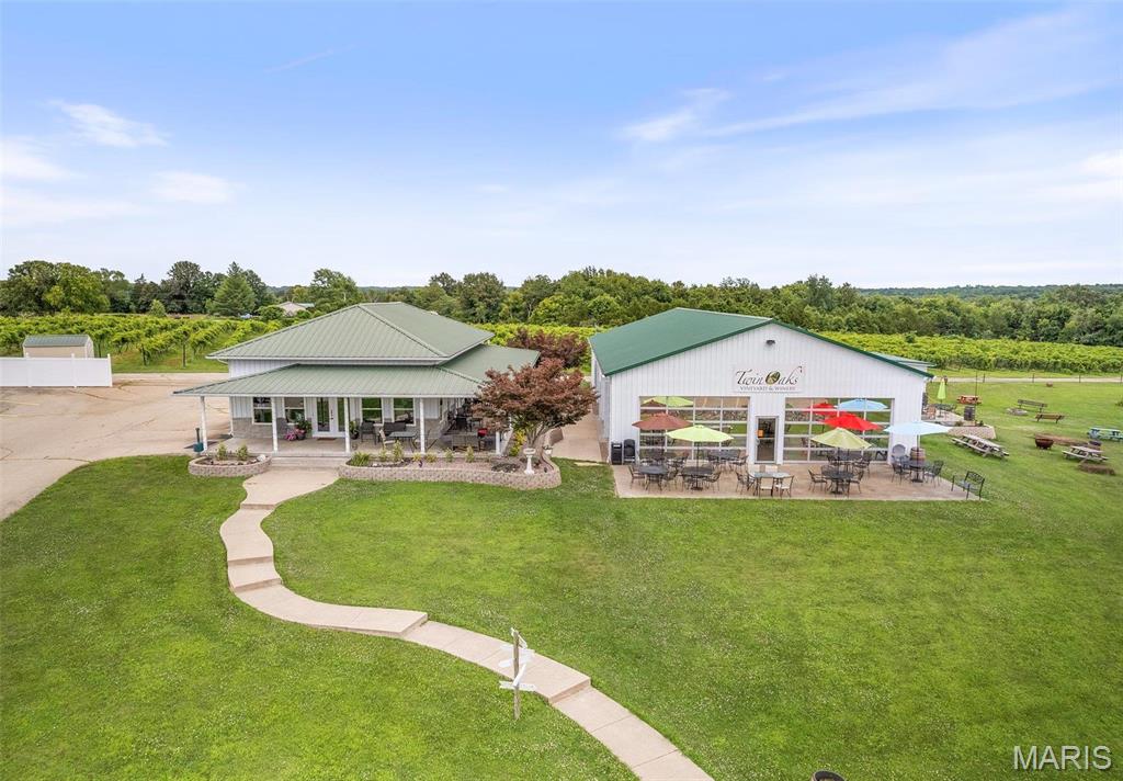 Embrace the chance to continue a legacy of hospitality and fine wine in a picturesque setting. Only an hour south of St. Louis. This family-owned business offers an inviting atmosphere for wine enthusiasts and casual visitors alike. Twin Oaks Event Center & Winery located just outside of Farmington  This turn key operation has 4.5 acres of vines and addt'l Orchard land. The Tasting Room has a turn-of-the-century bar, cozy fireplace, kitchen and has a wraparound porch. The indoor/outdoor Glass House overlooks the tranquil pond and the vines, has a large kitchen, bar and hosts numerous events. The Grande Oaks Event Center is the newest building and is the prefect place for a wedding or corporate event with a full kitchen, dance floor, stage, brides room and can seat up to 350 guests. The wine cellar comes complete with stainless steel tanks and the equipment used in the wine making process. Call for more information and details about this stunning property and business.