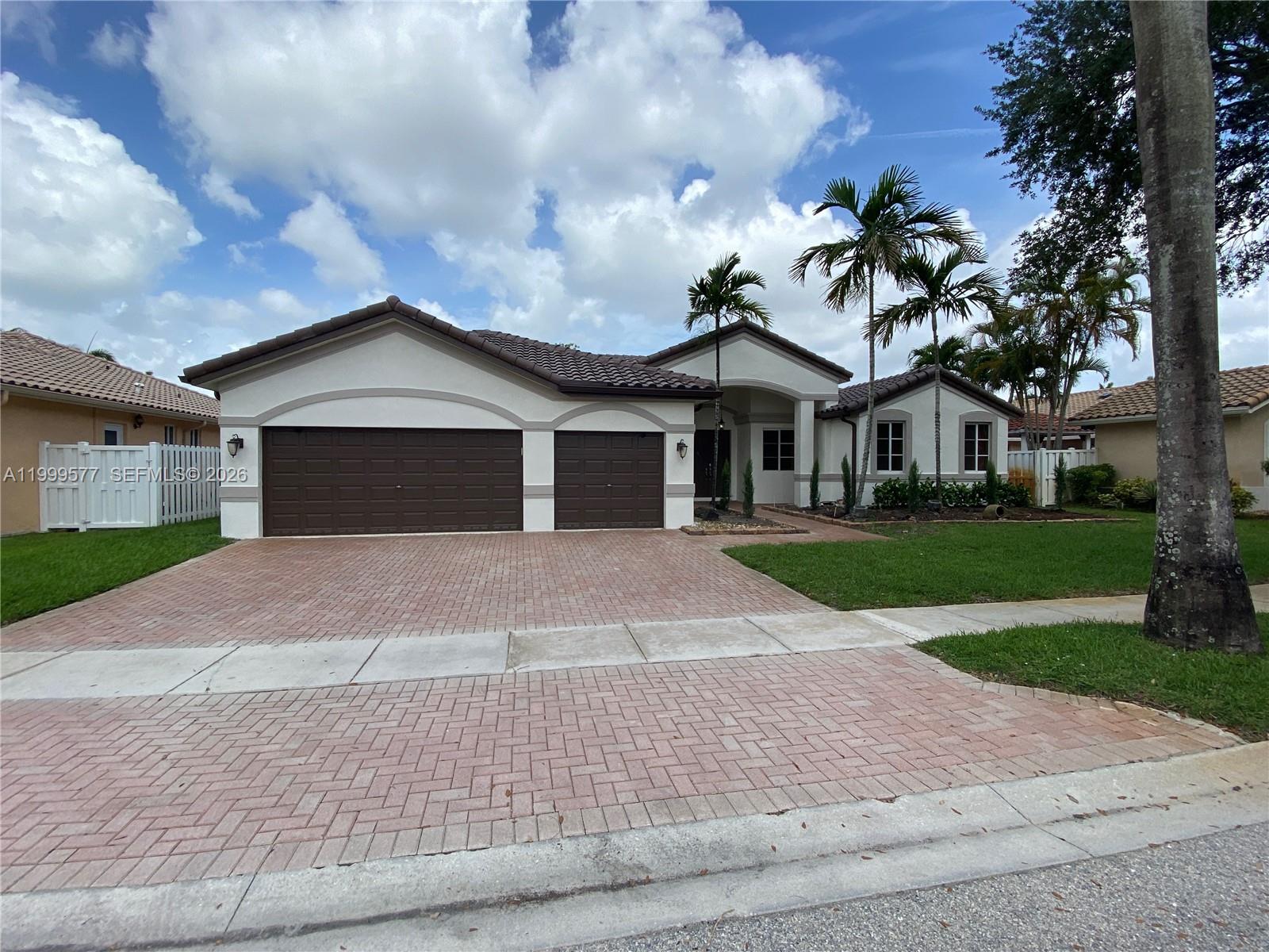Welcome to one of the most exclusive and well-sought-after communities in West Miramar. Over 3,000 square feet under air. Home features 4 bedrooms, 3 bathrooms, plus an office (can be used as a 5th bedroom). Double door entry, one story, triple split bedroom plan with 4th bedroom having privacy for in-laws, or guests, and its own separate entrance. Large Primary bedroom suite features privacy, away from the other bedrooms, includes a sitting area, his and her closets, newly remodeled, spacious primary bathroom with his and her sinks. New roof, 2024, and plumbing, 2025. Move-in Ready, a must-see.