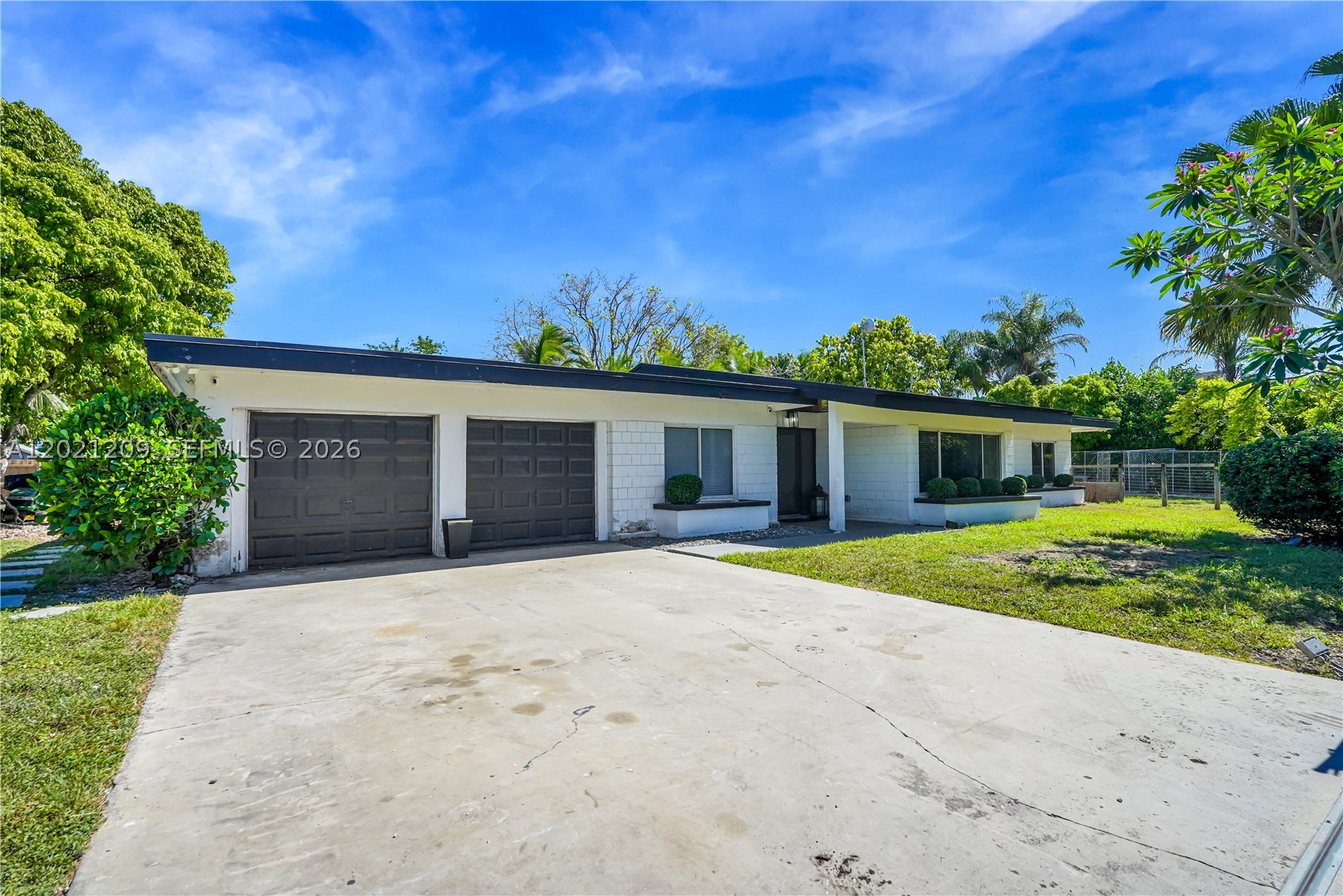 Welcome to your own private tropical retreat! This fully remodeled 4-bedroom, 2-bath with flex space pool home sits on an oversized, lushly landscaped lot offering the perfect blend of luxury, privacy, and indoor-outdoor living. From the moment you arrive, you’ll feel like you’ve escaped to a private resort.

Step inside to soaring vaulted ceilings, abundant natural light, and a stunning open-concept design centered around a designer kitchen featuring sleek quartz countertops, custom cabinetry, stainless steel appliances, and an oversized waterfall island perfect for entertaining. Modern finishes, warm wood accents, and spacious living areas create a bright yet inviting atmosphere throughout the home.

The backyard is truly unforgettable — a resort-style oasis complete with a sparkling pool, expansive covered tiki-style pavilion, outdoor kitchen/bar, lounging areas, and mature tropical landscaping that provides exceptional privacy. Whether hosting gatherings, enjoying quiet mornings in the hammock, or relaxing poolside, this outdoor space was made to impress.

The spacious split-bedroom floor plan offers flexibility for families, guests, or a home office setup. Every detail of this home has been thoughtfully updated, making it completely move-in ready.

Conveniently located near shopping, dining, beaches, and major roadways while still offering the peaceful feel of a secluded retreat. Opportunities like this are rare — schedule your private showing today!