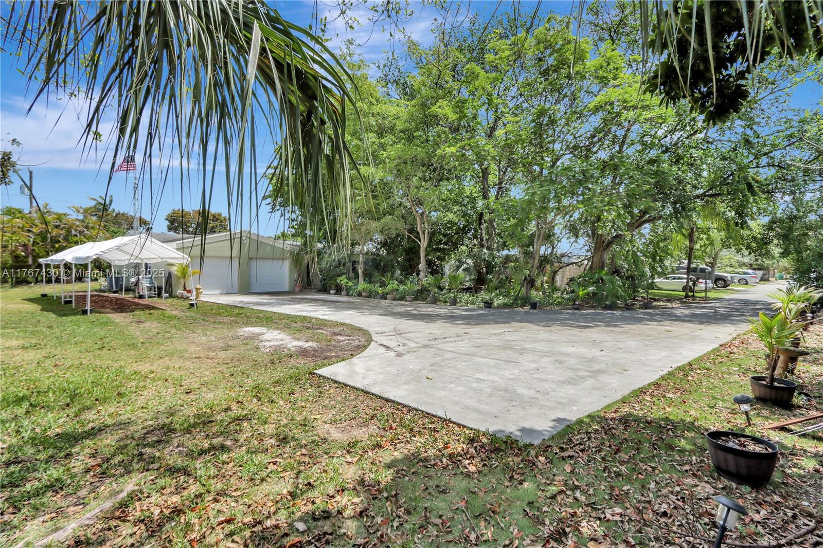 Discover this beautifully remodeled (2020) 3-bedroom, 2-bathroom home in the heart of Palmetto Bay! Nestled on a private .48-acre lot at the end of a dead-end street, this home offers peace and tranquility with lush greenery and ample outdoor space—plenty of room to add a pool. The inviting front sitting area is perfect for relaxing, while the oversized 2-car garage provides extra storage and convenience. Impact windows throughout offer security and energy efficiency. A rare find in a sought-after location, walking distance to Palmetto Bay park—don’t miss out on this cozy and private retreat!