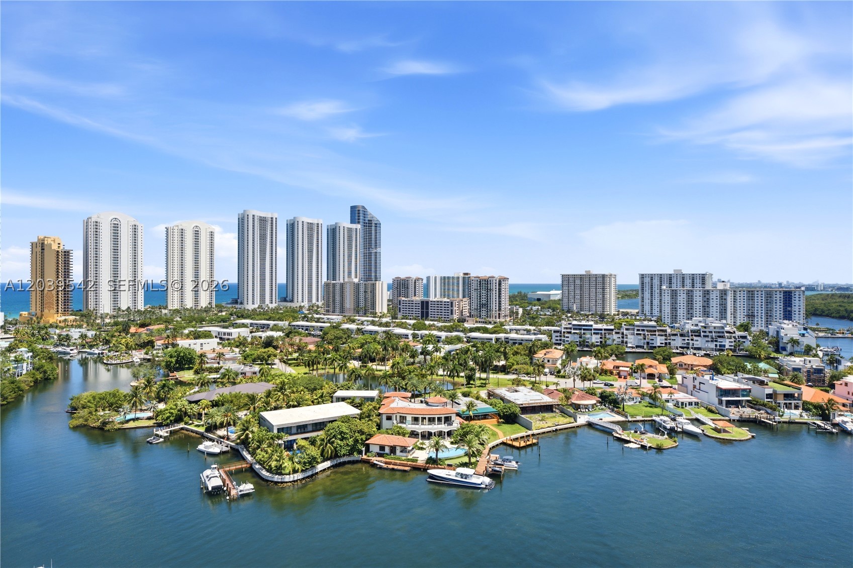 Experience elevated waterfront living at 400 Sunny Isles East with this rare combination of space, views, and prime location in the heart of Sunny Isles Beach. This bright and spacious 1,553 SF, 2-bedroom + den, 3-bath residence features a highly desirable split-bedroom floor plan designed for both privacy and functionality. The versatile den functions as a third bedroom with its own ensuite bathroom, while also offering the flexibility to be converted into a private office, media room, or guest suite.

Enjoy breathtaking views of the Atlantic Ocean, Oleta River State Park, the Intracoastal Waterway, and Biscayne Bay from the comfort of your own home! 

Conveniently located minutes from the beach, Haulover Park, Oleta River State Park, Bal Harbour Shops, and only 10 minutes from Aventura Mall, residents enjoy resort-style amenities and easy access to boating, recreation, dining, and  world-class shopping.

For boating enthusiasts, the owner offers a rare opportunity to purchase a fully deeded private indoor boat slip accommodating a vessel up to 35 feet for $230,000. Located on the marina's ground level, the slip includes access to a full-service marina and valet boat service. Enjoy quick access to open waters, just minutes from Haulover Inlet and the world-famous Haulover Sandbar, while keeping your vessel protected from the elements year-round.