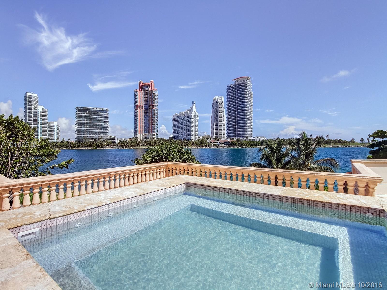 Coveted large 4BR ground floor unit in Palazzo Del Mare! Boasting ultra luxurious contemp finishes & decor in serene neutral colors. Soaring ceilings, MSTR suite w/cozy library/den & sep his/hers MSTR BA & PVTE TER. Ample brs w/en-suite BA, serene grey limestone flrs. Natural stones throughout, chandeliers & fixtures by Waterworks. Incl poolside CABANA, 3 GAR parking spcs, lge A/C STGE & 2 golf carts. Expansive 4000+/-SF TER w/summer KIT & custom jacuzzi perfect for entertaining. Breathtaking SOBE views