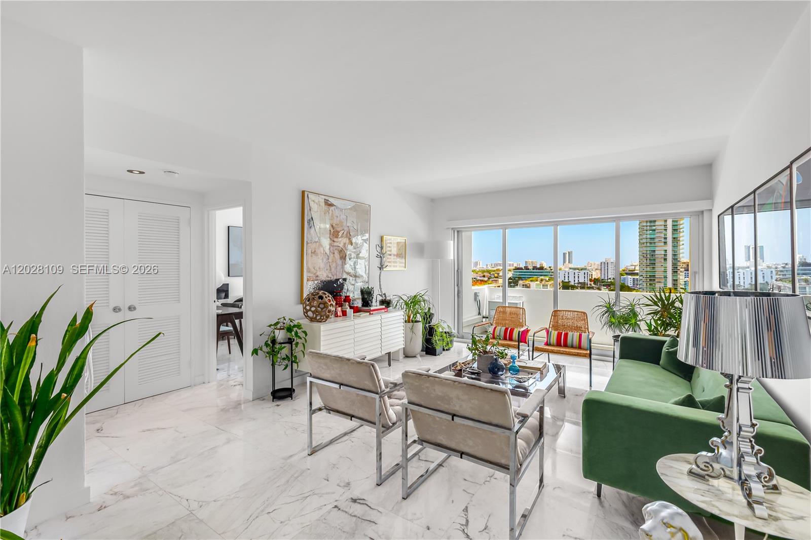 Bright one bedroom apartment in cool Morris Lapidus building on Belle Isle. Renovated with sleek carrara marble floors throughout with semi-open kitchen. Spacious bathroom with opening to admire the views with natural light. Impact windows and newly permitted wall-to-wall sliding doors which open both ways to enjoy water and park views from an ample balcony. This condominium
has a stunning west facing pool and deck on the bay to sunbathe and rejoice in the most fantastic sunsets all year round. Located in hip and trendy Belle Isle on the Venetian Causeway, right across The Standard Hotel. Just steps away from restaurants and Trader Joe's, Fresh Market and Publix in Sunset Harbour and Lincoln Road. Ready to move in and easy to show!