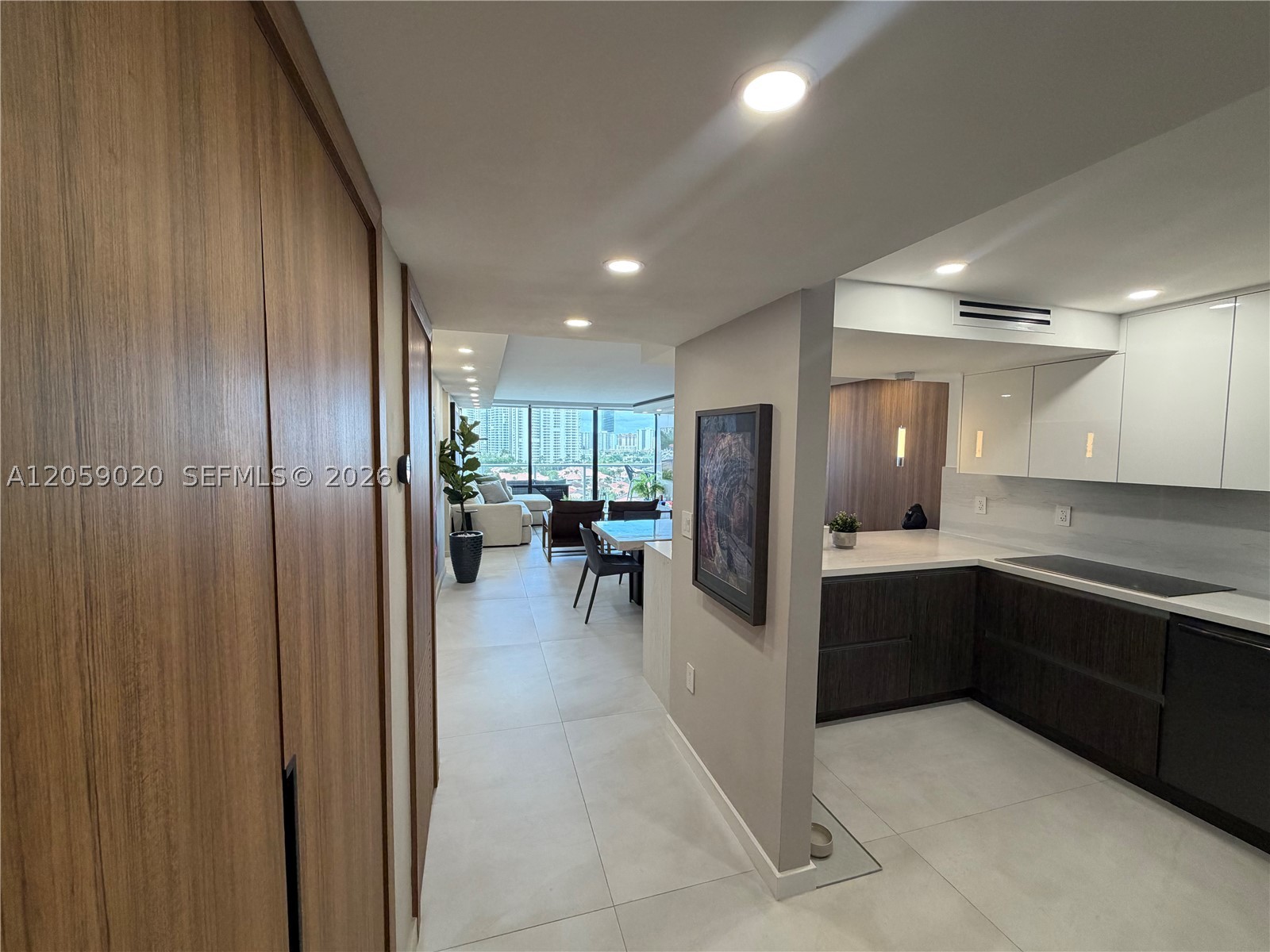 Stunning, fully renovated 2 bedroom - 2 bath residence at Flamenco Towers in Aventura. This designer home features a bright open concept layout, sleek modern kitchen, custom wall paneling, full height porcelain bathroom walls, linear A/C diffusers, dimmable lighting, and an integrated smart-home system. Step onto the spacious balcony and enjoy captivating intersecting canal views that create a true waterfront backdrop. Sophisticated, polished, and completely move in ready. This is not your typical condo renovation!