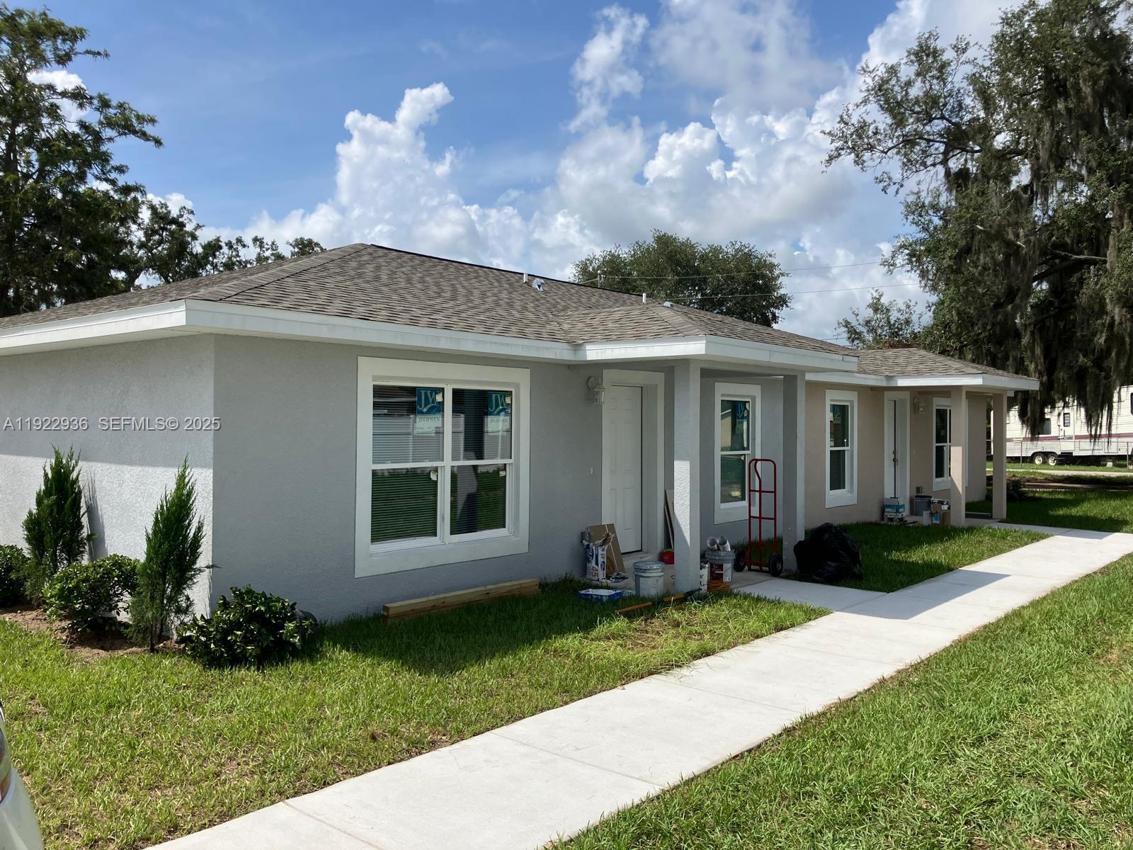 New Construction concrete block and move in ready home 3 bed 2 bath, parking for 3 cars. Walking distance to downtown Sebring 'The Circle', amenities and local services. Blinds in every room, walk-in closet, brand new appliances including washing machine, dryer, oven range, microwave, fridge freezer with ice maker, dishwasher. Landscaped frontage, and large backyard. Landscaping included in rent. Pets welcome. High quality vinyl flooring, high quality kitchen cupboards and quartz worktops. Ceiling fans in every room. Sebring Florida is the home to the famous International Sebring Raceway. Close to amenities, restaurants, hospitals, grocery stores, a choice of lakes for fishing and water sports. Florida Sun.