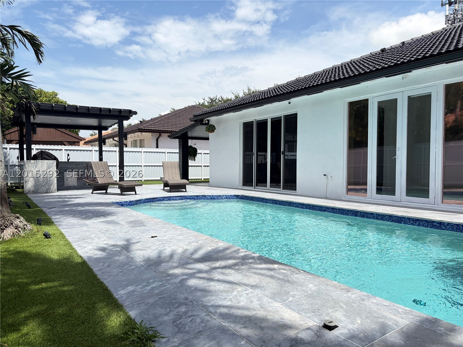 Beautiful pool home located in the prestigious Royal Oaks community in Miami Lakes. This stunning property features 4 spacious bedrooms, including a majestic master suite, and 2 fully renovated bathrooms. The home offers a modern Italian-style kitchen fully equipped with high-end finishes and appliances, perfect for both everyday living and entertaining. Enjoy the Florida lifestyle with an outdoor kitchen designed for family gatherings and weekend entertainment. Spacious 2-car garage, excellent layout, and prime location close to top schools, shopping, restaurants, and major highways. A true gem in one of Miami Lakes’ most desirable neighborhoods.