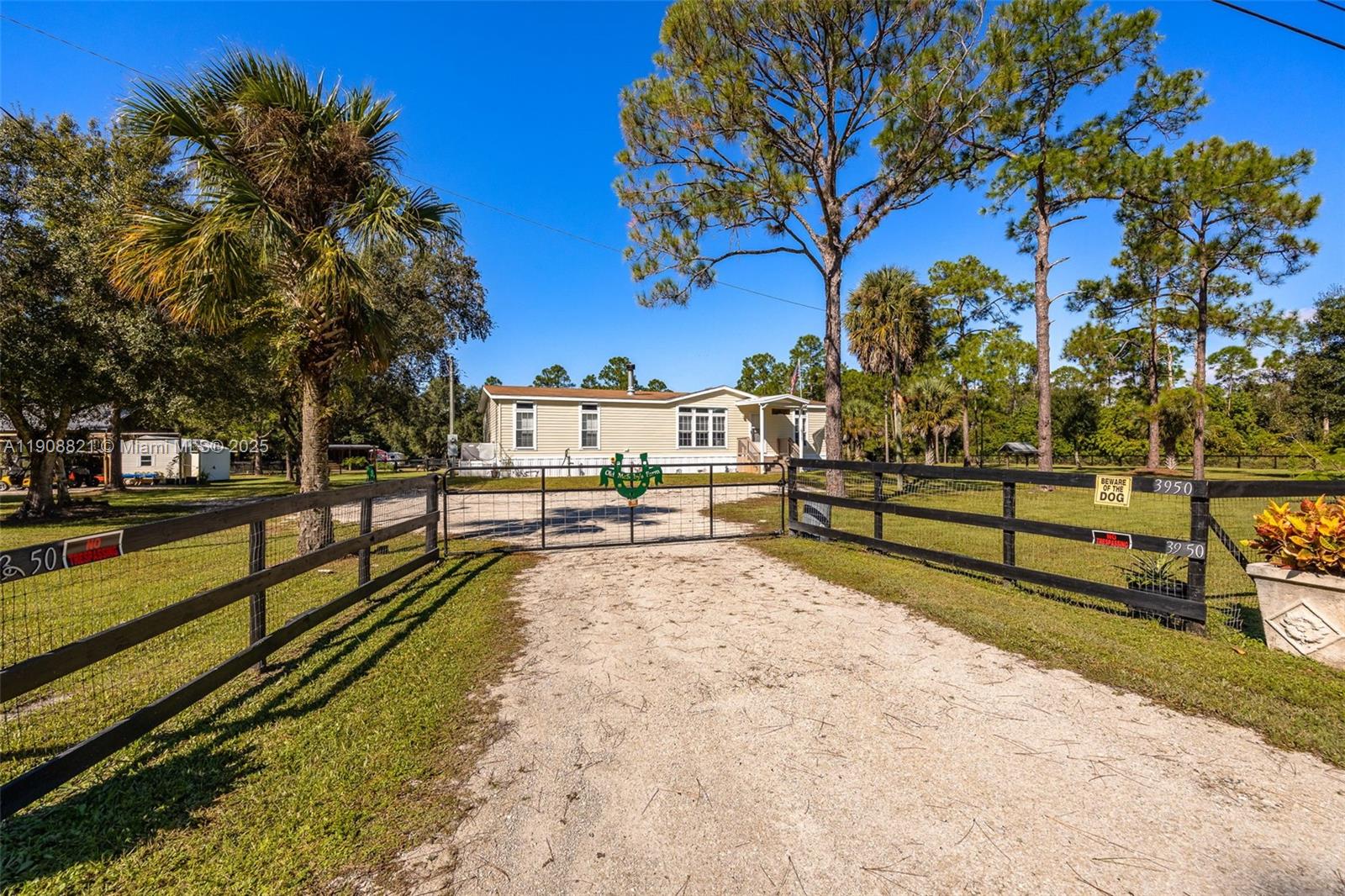 Pristine ranch retreat! This beautifully maintained 3-bedroom, 2-bath home sits on 2.5± fenced and cross-fenced acres, perfect for those seeking a peaceful country lifestyle. The home is move-in ready and features low-maintenance vinyl flooring, a real wood-burning fireplace, an open kitchen, and a large laundry room that conveniently connects to the guest bath. Enjoy outdoor living on the spacious screened back porch or relax by the above-ground pool complete with a deck and barbecue area. The property is fully equipped for horses or livestock, with two paddocks, a stable, tack shed, storage shed and covered storage area. Ideally located just 10 minutes from The Glades Golf Resort and Marina and about an hour and a half from Miami or Fort Lauderdale.