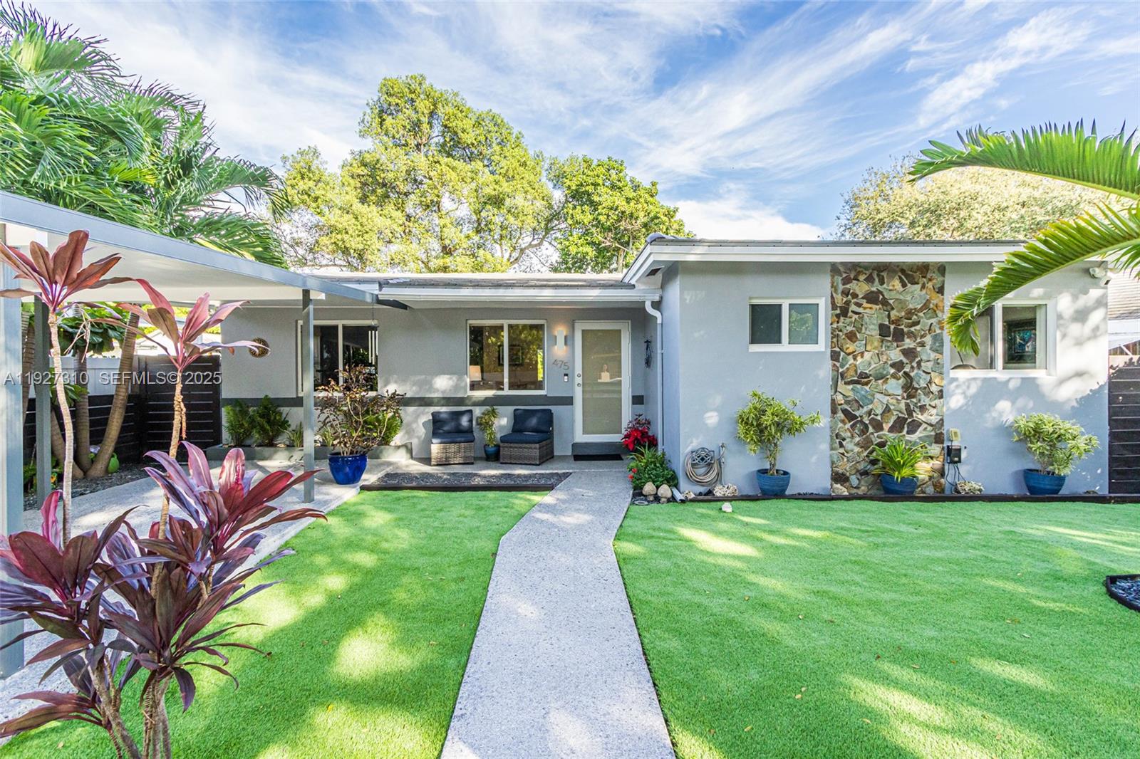 Live the Miami lifestyle in this beautifully renovated 3BR/2BA single-family home, just blocks from the Design District, Midtown, and Wynwood. Thoughtfully updated throughout, the home features a new roof, full-impact windows and doors, renovated kitchen and baths, and high-end Samsung appliances. Open, comfortable living spaces flow seamlessly to the lush landscaped backyard creating an effortless indoor-outdoor living perfect for relaxing, entertaining, or planning a future pool. The property is packed with valuable upgrades, including an 8x12 impact-rated metal shed (anchored 10 feet deep on all corners), Ring cameras front and back, a full-coverage sprinkler system with well, epoxy-coated driveway and patio, and re-coated sewer/drainage lines for long-term peace of mind. The AC was replaced in 2019 and has been professionally serviced every six months. Set in one of Miami’s highest and most flood-resistant areas, this quiet neighborhood is known for its friendly neighbors, privacy, and unbeatable central location. You're minutes from world-class dining, shopping, art, culture, and major transportation. Stylish, turnkey, and positioned in one of Miami’s hottest corridors this is modern Florida living at its best.