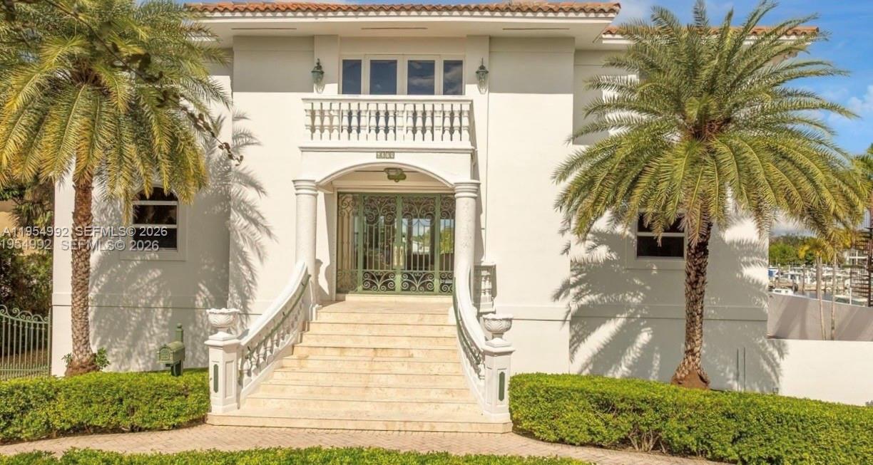 Welcome to Paradiso, a distinguished Mediterranean-style Italian villa set along the coveted waterfront of Kings Bay. Elevated with the primary living level positioned approximately 18.3 feet above sea level, this exceptional estate offers commanding water views, enhanced resilience, and architectural presence rarely found in coastal properties. Merging Old World elegance with modern luxury, the residence showcases soaring ceilings, expansive glass, and light-filled open living spaces designed for both grand entertaining and refined everyday living. The chef’s kitchen is appointed with premium appliances, custom cabinetry, and elegant stone surfaces, seamlessly connecting formal and informal gathering areas. A private in-home elevator service all floors, ensuring effortless access throughout the home. For boating enthusiasts, Paradiso stands apart with five private docks capable of harboring vessels up to 50 feet, providing immediate access to open water. Automotive collectors will appreciate the extraordinary 3,300-square-foot garage that easily accommodates eight automobiles plus additional storage—ideal for vehicles, marine equipment, or workshop use. Expansive waterfront terraces create an unforgettable setting for sunset entertaining, completing this rare offering that combines elevated construction, premier maritime capability, significant automotive capacity, and timeless Mediterranean luxury in one of Florida’s most desirable boating communities.