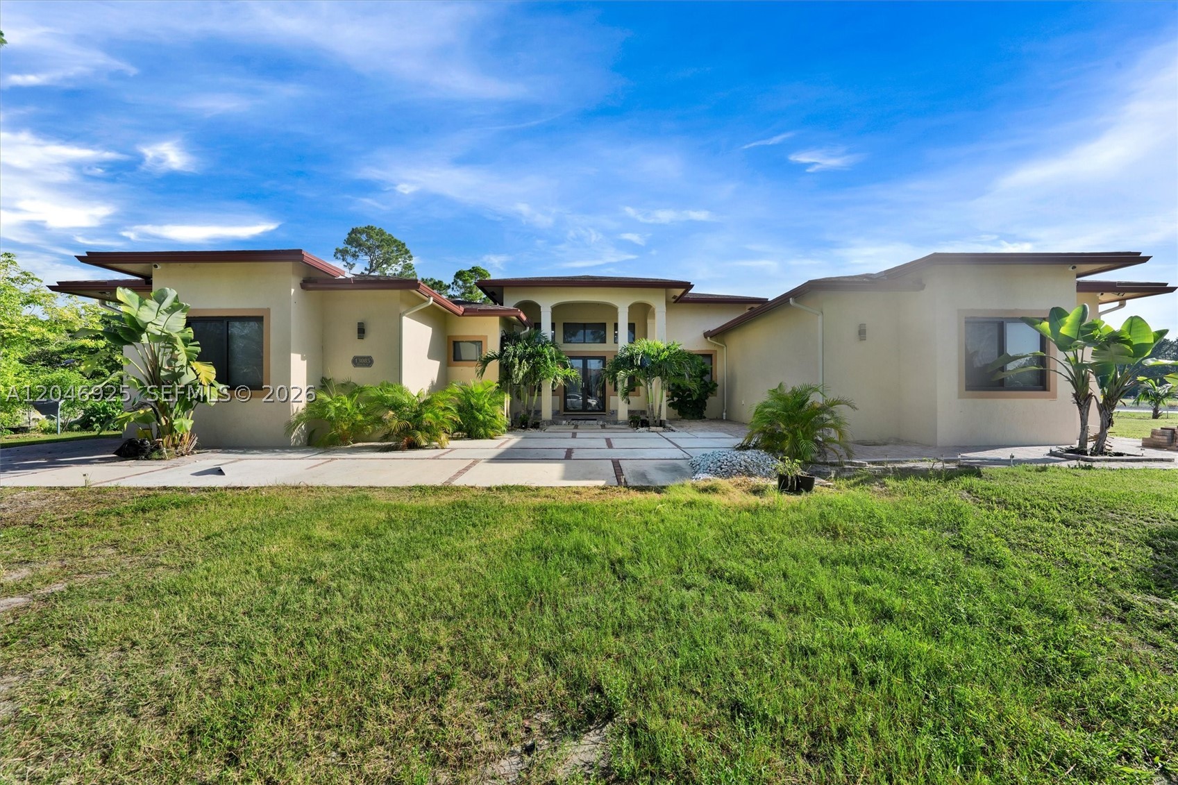 Stunning single family contemporary home with high level upgrades move in ready, marble tiles throughout. This 5 bedroom, 5 full bathroom, property provide a living style above the rest, that can only be experience in this coveted area of West Palm Beach. This is a rear opportunity to own a property that was made by the contractor for his family. Situated on an estate size lot, offering over 4500sqf of living space, with soaring ceiling abundance natural lightings, with impact windows and doors, design with an open concept. The exceptional outdoor living area is the true show piece for installing a resort style pool, expansive entertainment patio, and covered summer kitchen. NO HOA
