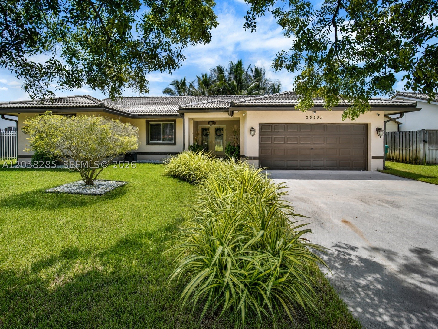 Imagine coming home to a spacious single-story residence where everyday convenience, flexibility, and peace of mind come together. Located in Valencia Grove, this 4-bedroom, 2-bath home offers 1,723 square feet of comfortable living space, a 2-car garage, and a fenced 7,500-square-foot lot with room to relax, entertain, garden, or create your ideal outdoor retreat.

The practical layout provides space for guests, a home office, hobbies, or changing household needs. French doors, a pantry, an open porch, and a backyard deck add character and everyday functionality. Municipal water and sewer and no HOA fees make ownership even more convenient.

Buy with added confidence: the home has already been inspected and includes transferable warranties—5 years against roof leaks; 6 months covering appliances and mechanical systems; 6 months for plumbing entering and exiting the home; plus 6-month mold and structural warranties, subject to warranty terms.

Enjoy quick access to groceries, parks, shopping, Zoo Miami, major roadways, and the best of the South Dade lifestyle. A four-bedroom home with this combination of space, location, no HOA, and buyer protection deserves to be seen. Schedule your private showing today.