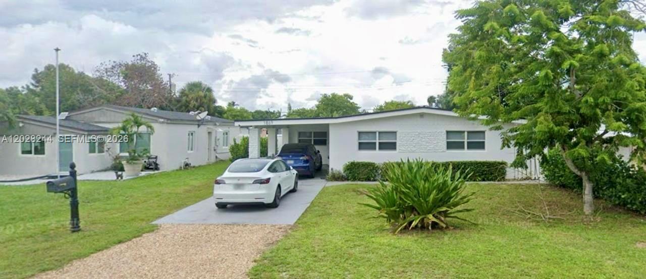 FULLY REMODELED IN 2023 - WITH PERMITS AND UP TO CODE. Stunning 3BR/2BA at the nexus of North Miami & Aventura. Features volume ceilings with exposed beams & floor-to-ceiling impact glass that floods the home with natural light throughout its open concept layout. Custom-built dream kitchen with exquisite marble countertops and stainless steel Frigidaire appliances. High-end finishes and sleek modern design elements are found throughout, creating a refined yet inviting atmosphere. Generously sized bedrooms. Master walk-in closet custom made with embedded led lighting. Florida room opens up to the lush, large backyard fully lined with clusia trees to enhance privacy and create a resort style yard with plenty of room for pool. No HOA. No restrictions. Conveniently located minutes from Aventura Mall, shopping, dining, the beach, and main highways.