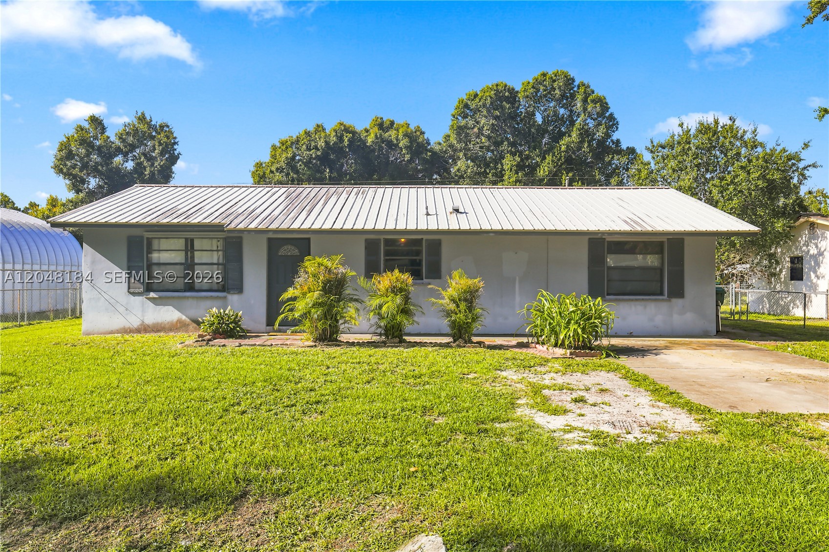 Opportunity awaits! This 3-bedroom, 1-bath single-family home is packed with potential and ready for its next chapter. Whether you're a first-time homebuyer looking to build equity, a homeowner eager to create your dream space, an investor searching for your next opportunity, or a handyman ready to bring your vision to life, this property offers exceptional value and endless possibilities.

Major updates have already been completed, including a newer 2023 metal roof and an A/C system professionally serviced in 2023, Water Heater 2020, Electrical Panel 2023, allowing buyers to focus on the interior renovations. Situated on a spacious lot, the backyard offers plenty of room to park your boat, RV, trailers, or other toys, with additional space to build a pool, shed, pergola, workshop, or create your own outdoor oasis. The oversized driveway provides ample parking for family and guests.

Conveniently located near schools, shopping, restaurants, parks, medical facilities, and major roadways, this home offers both privacy and accessibility while being just a short drive to Lake Okeechobee for world class fishing, boating, and outdoor recreation.

Property is being sold AS IS with the right to inspect. Buyer and buyer's agent are responsible for independently verifying all information, including but not limited to measurements, square footage, lot size, zoning, permits, taxes, schools, and any other information deemed important to the buyer.
