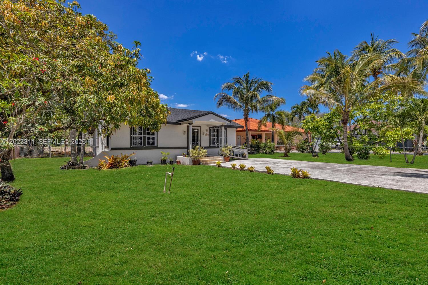 Great opportunity to live in this special neighborhood! Home sweet home!  This house is solid and strong and served one long-time owner well....kept in meticulous ready-to-move-in condition.  As soon as you walk in, you will feel welcome and 'at home'....It has had plenty of entertaining and laughter here. The house has grown over the years, with 2006 permits reflecting 462 sq.ft. offering flexible additional living space, or used as over-flow guest-room space with a private entrance from the special fenced back yard boasting the best trees bearing delicious mangos! A Wonderful surprise with a 10,575 huge lot on the water with plenty of room to add-on ..peaceful and ready for some relaxing weekends of fishing!  We are easy to find. se habla espanol.*****PLEASE NOTE - ALL OFFERS will be presented on June 12, 2026. Seller will NOT accept an offer before June 15, 2026.
