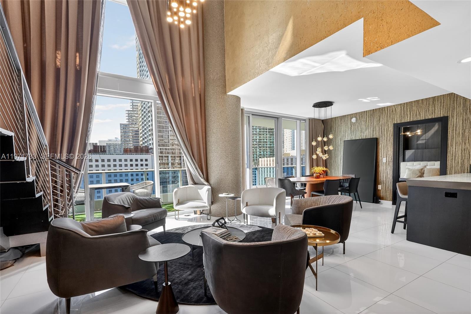 Live in luxury at EPIC Residences! This 2-bedroom + den residence offers stunning water and Miami River views from a private balcony and expansive floor-to-ceiling windows. The open-concept layout is bright and airy, featuring sleek, modern furnishings that create a stylish yet comfortable atmosphere.

The contemporary kitchen flows seamlessly into spacious living and dining areas, ideal for everyday living or entertaining. The versatile den can serve as a home office, media room, or additional guest space. The primary suite provides comfort and privacy, while the second bedroom is generously sized.

Located in the heart of Downtown Miami near Brickell, residents enjoy resort-style amenities including pools, fitness center, spa, concierge, and 24-hour security. Vacant and move-in ready, this turnkey residence presents an exceptional opportunity for end users or investors seeking luxury waterfront living in one of Miami’s most desirable buildings.