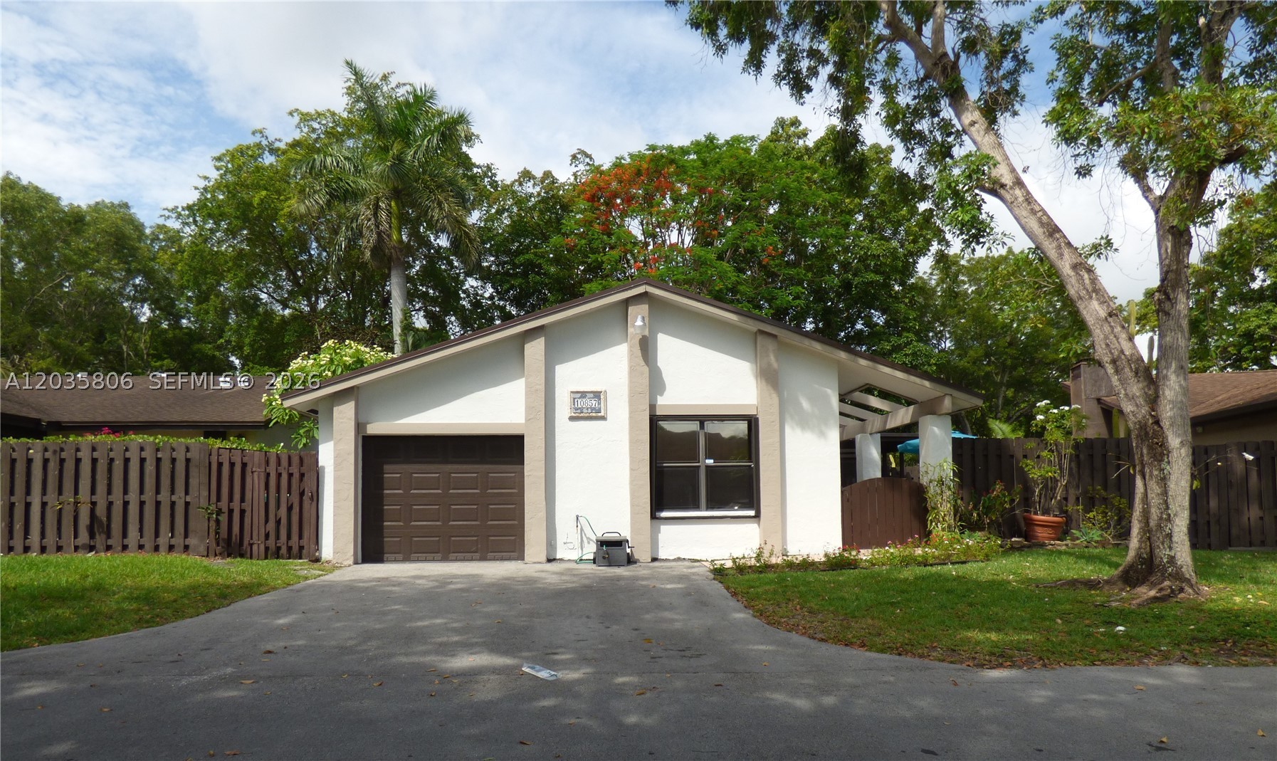 Welcome home to The Crossings, one of Kendall's most desirable neighborhoods, where mature lush trees, peaceful streets, and a gentle breeze create a lifestyle that's hard to find in Miami. This well maintained 3-bedroom, 2-bath home offers an open-flow layout filled with natural light, creating a warm and inviting space for everyday living and entertaining.  Enjoy your own private retreat with a pergola-covered patio and a unique double-fenced backyard that's perfect for families, pets, and outdoor gatherings. Dogs are welcome, and the expansive yard provides plenty of room to play safely and securely. The master suite offers a tranquil atmosphere and even a relaxing moonlight view, creating the perfect place to unwind after a long day. Throughout the home, you'll find a sense of quiet, peace, and Zen-inspired comfort rarely found in rental properties.  For added convenience and peace of mind, the home includes accordion shutters and a generator. Directly across the street you'll find a community pool and playground, while grocery shopping, restaurants, and everyday essentials are just 3 minutes away. This is an ideal home for those seeking a safe, established neighborhood where children and dogs can thrive while enjoying the privacy, beauty, and lifestyle that make The Crossings one of Kendall's most sought-after communities. Available now. Experience the perfect blend of comfort, convenience, and tranquility in the heart of Kendall.