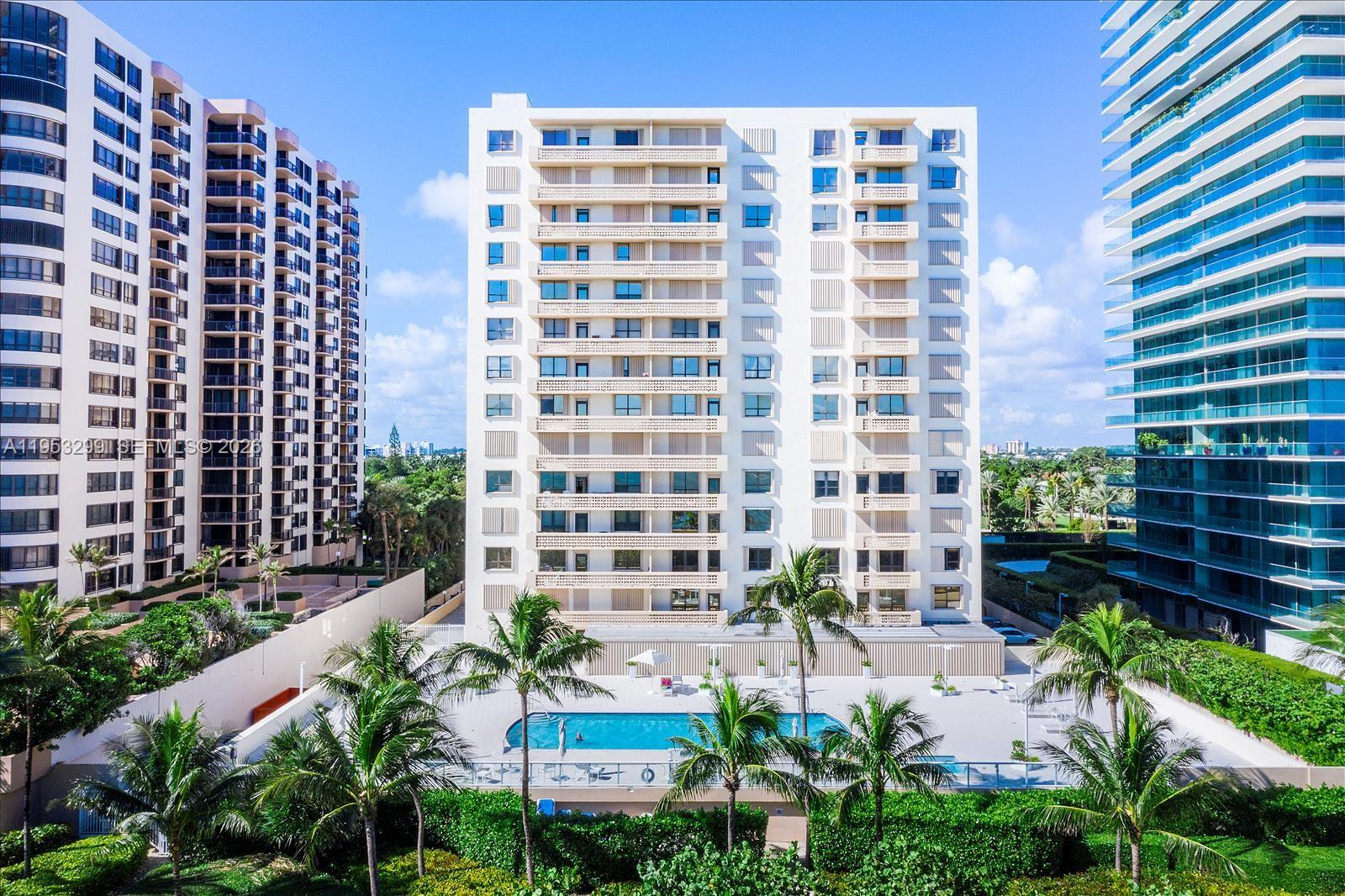 Spacious 1-bed/1-bath plus den/guest room (with built-in bed and desk) in a full-service waterfront high-rise. This beautifully updated unit offers unobstructed ocean and bay views, hurricane-impact windows and balcony doors, and tile flooring throughout. New kitchen appliances complete the modern interior. Building features include a full-time lobby attendant, fitness center, community pool, sauna, billiard room, and elevator. Ideal location near Bal Harbour Shops, restaurants, and beaches.