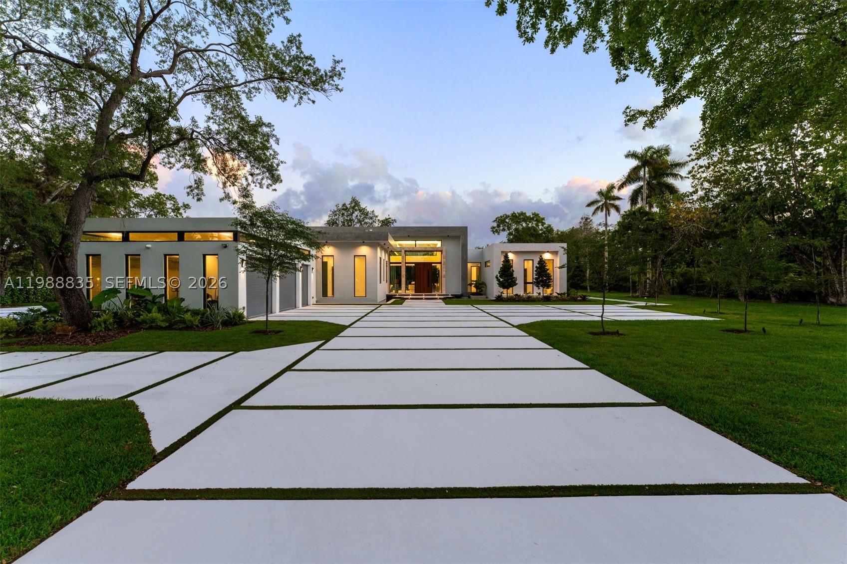 A masterclass in refined, brand-new construction, this extraordinary one-story estate sits on a 1.4-acre private cul-de-sac lot, offering exceptional privacy. Soaring 20-ft ceilings define the grand great room with telescopic, disappearing sliding doors for seamless indoor-outdoor living. The home features 6 bedrooms, 6 full and 1 half baths, all en-suite, including a luxurious primary with dual walk-in closets and spa-like bath. Designer finishes, top-tier appliances, butler’s pantry, and private theatre enhance the interiors. Wellness is elevated with a gym and sauna, while a sunroom surrounded by reflecting pool and koi ponds creates a tranquil retreat. Resort-style grounds include tennis and basketball courts, cabana bath, summer kitchen, climate-controlled 2.5-car garage, and gas fireplace.
