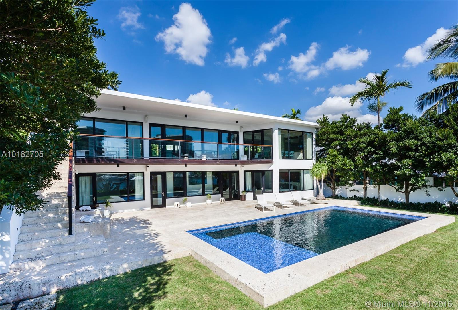 Completely rebuilt and redesigned in 2011, this spectacular modern home in Coconut Grove features 85 ft. of gorgeous waterfront. Expansive windows and doors let in natural light showcasing views of Biscayne Bay. Great for entertaining, the home features a heated saltwater pool and indoor/outdoor spaces overlooking the water. Helping define the striking home are designer finishes such as Brazilian teak wood and basalt stone countertops. Excellent location near parks, shopping, dining and entertainment.
