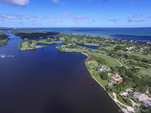 This is a very special location at the end of a shady tree-lined road in the heart of Jupiter Island.  The 1.4+/- acre property's generous dimensions include 200+/- feet of river frontage ensuring the ultimate in privacy and room for expansion.  The precious 5/5.5 home, designed by renowned architect Kemp Caler, beautifully portrays the elegant and graceful style Caler was known for.  Built in 1966, the house could lend itself to renovation while keeping the charming elements of its distinctive design.
