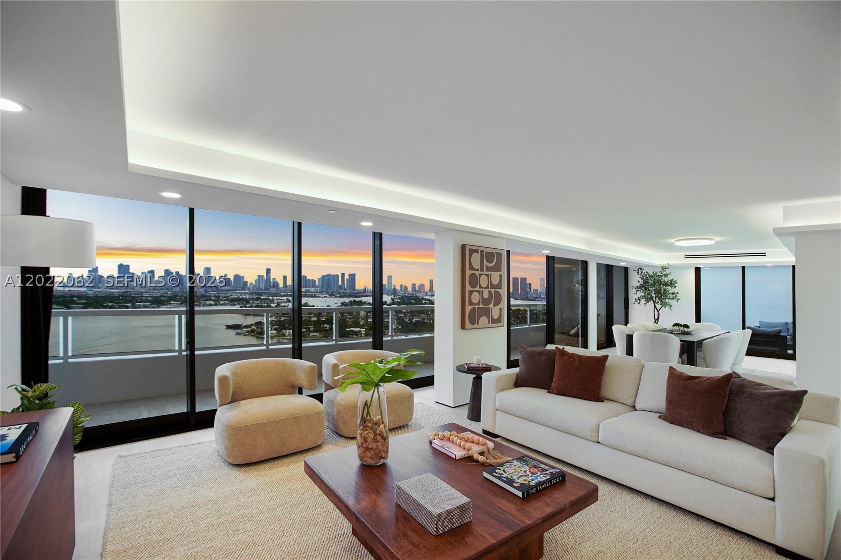 A rare opportunity, this penthouse on Belle Isle, just delivered after a architect-permitted , studs-out renovation, increasing the living area to over 2300 sqft(1). The interior reads as a sky loft: walls reimagined into one continuous great room that flows past full-height impact glass to a chef's kitchen anchored by a calacatta-veined waterfall island. Continuous large-format tile flooring, beneath cove-lit ceilings, an integrated wine bar, designer fixtures and smart-lighting throughout.
Unobstructed, panoramic views of the entire Miami skyline and Biscayne Bay reach into every principal room, then wrap onto an oversized entertaining terrace. Combined with the infinitely long balcony, this top-floor unit has more than 850 SF of outdoor space. Three bedrooms (or two plus a private den or office), three full baths and two garage-parking spots.
Full-service at Nine Island Condos: private marina, enormous pool deck(2), spa, gym, yoga studio, restaurant, valet, doorman. Steps to Sunset Harbour, The Standard, Lincoln Road. 

(1)Updated square footage on record with the city. To be updated soon.
(2)Pool/Spa plans have been approved and final construction is to commence soon.