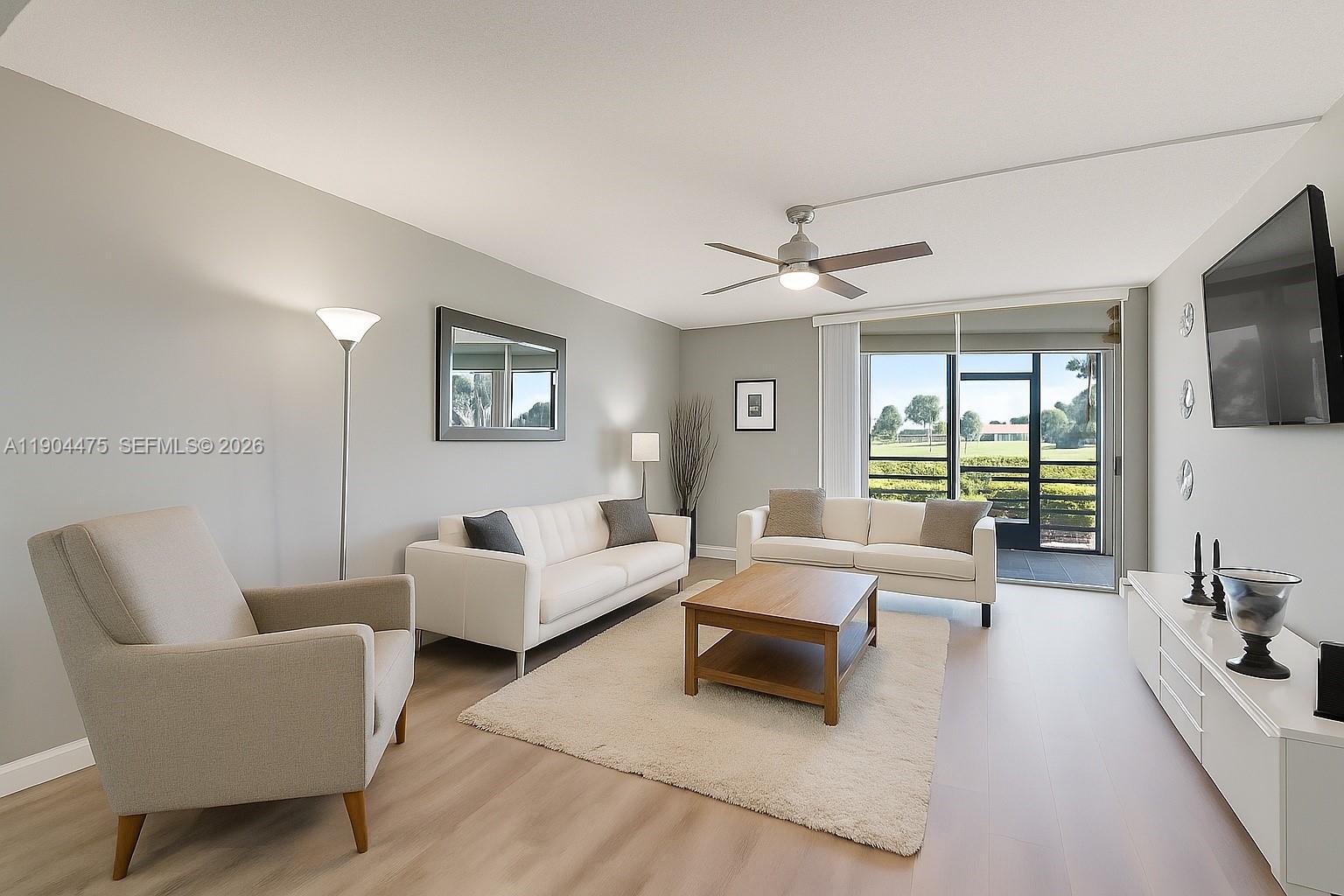 HOA IS ONLY $475/MONTH - THE LOWEST IN THE AREA, WITH STRONG RESERVES AND MAJOR UPDATES ALREADY COMPLETED — roof, painting, elevators, milestone inspection & SIRS DONE. Peace of mind and value in one!

Wake up to sweeping panoramic golf course views in this beautifully updated first-floor 2BR/2BA residence in the highly sought-after 55+ Boca Barwood community. Enjoy your morning coffee from the enclosed sunroom where sliders open to let the breeze in — or create a cozy additional living space year-round.

This immaculate condo features updated kitchen cabinetry, modern vanities, upgraded lighting, and luxury vinyl flooring throughout. A full-size washer and dryer are conveniently located in the sunroom, and your designated covered carport protects your vehicle from the Florida sun.

Resort-style amenities include pool, tennis, pickleball, and clubhouse — all within a meticulously maintained community just minutes to shopping, major highways, and the beach.

Exceptional value. Move-in ready. Sellers are ready for your offer.