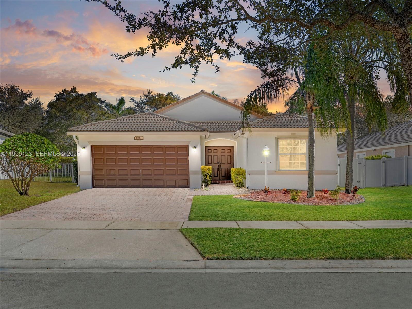 Rarely available Bimini split-plan home in gated Pembroke Falls! This 3BR/2BA gem features a renovated kitchen with wood cabinets, granite counters, & stainless appliances opening to a bright family room with volume ceilings. Spacious master ensuite includes a large walk-in closet. Outside, enjoy a covered patio & massive yard with room for a pool. Modern updates: AC (2020), Water Heater (2018), & accordion shutters. Exterior of home was just freshly painted. HOA fee includes High-speed Internet, Cable, ADT alarm, 4 guard gates, & resort-style amenities (Pool, Fitness Center, Tennis, Pickleball, Basketball, Playground). Centrally located near I-75 & The Shops at Pembroke Gardens. Zoned for top-rated Lakeside Elementary. Natural gas lines for kitchen, water heater, & patio. Leasable 1st year.