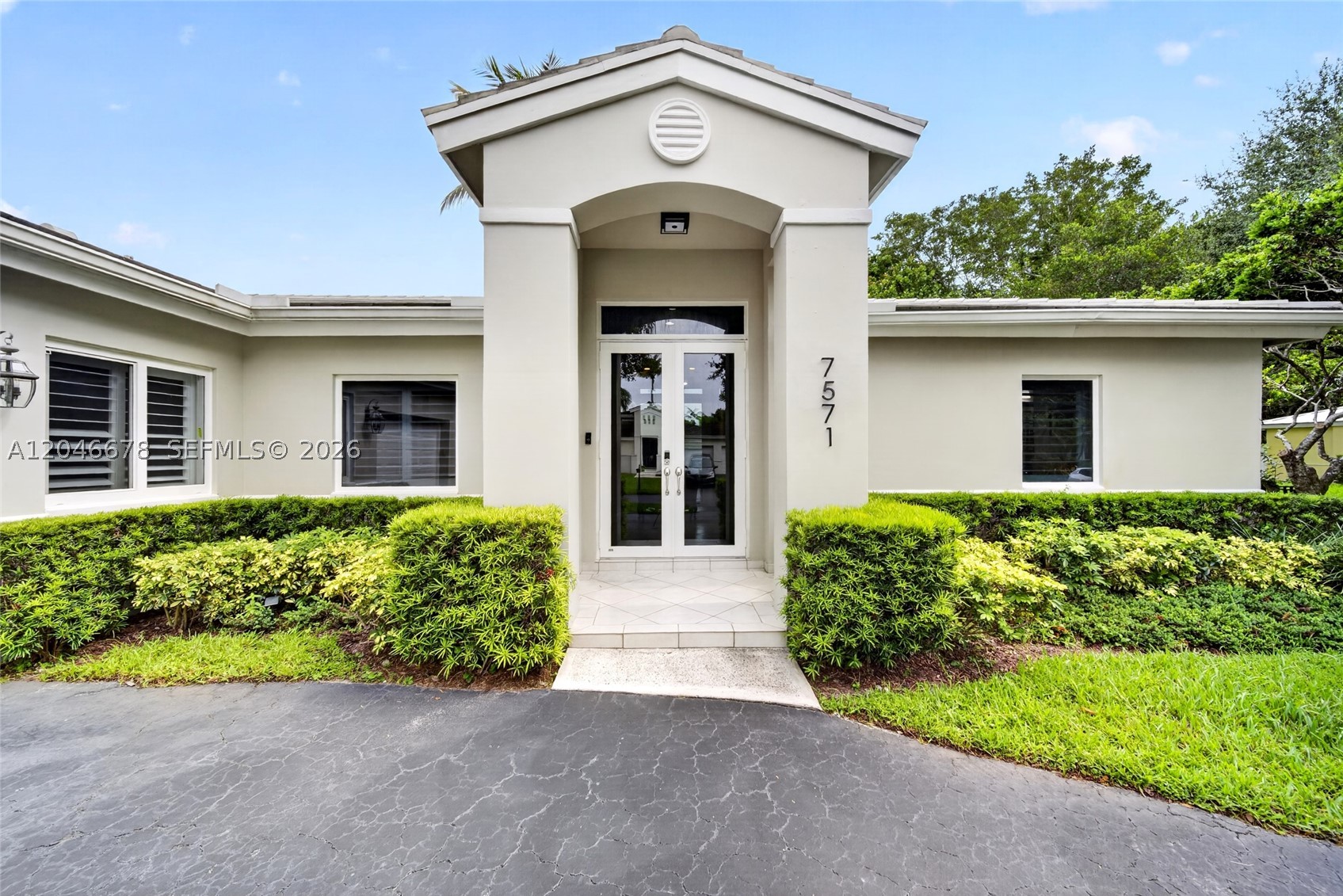 Rare opportunity to own a meticulously maintained canal-front home in Old Cutler Cove, one of the few gated communities in Palmetto Bay with low HOA fees. Ideally situated on a cul-de-sac, directly across from Coral Reef Park, this property offers exceptional privacy with no rear neighbors and a 20,313 square foot lot with ample room to design and build your custom waterfront pool.  French doors in the primary suite, living room and kitchen lead out to the tranquil backyard with picturesque canal views.  Neighbors enjoy fishing, paddleboarding and small watercraft in the navigable canal.  This move-in-ready home features 4 bedrooms, 2.5 baths, vaulted ceilings, tile flooring, abundant natural light and a coveted split bedroom plan.  Recent upgrades include new electrical panel and conduit, digital irrigation system, face and fingerprint recognition smartlock, Nest thermostat, under sink RO system, custom closets, plantation shutters, aluminum fencing and brand new combo washer/dryer.  Ideally located near the “A” rated Coral Reef Elementary school, neighborhood parks and the popular local farmer’s market.  This exceptional home offers serene water views, modern conveniences, and unparalleled privacy.