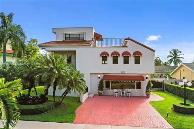 Single-family home with 3,517 sq.ft, 5 beds, & 3.5 bath. Located on a private cul-de-sac, this stately 3 story home has impressive curb appeal with a long driveway, hurricane impact windows, sophisticated landscaping, an outdoor bar, and a large flex space/game room downstairs. Adding to the immense size of the home are several newly refinished outdoor spaces including a 463sq.ft. terrace attached to the master bedroom with spectacular panoramic views. Windows and a large skylight make this a bright home. Upgrades throughout & a generous lot size with space for a pool & boat. The lower floor can be used as an in-law quarter with a 2nd fully-equipped kitchen creating 2 independent spaces: 3br/2.5ba upstairs and 2br/1ba downstairs. Country Walk area.