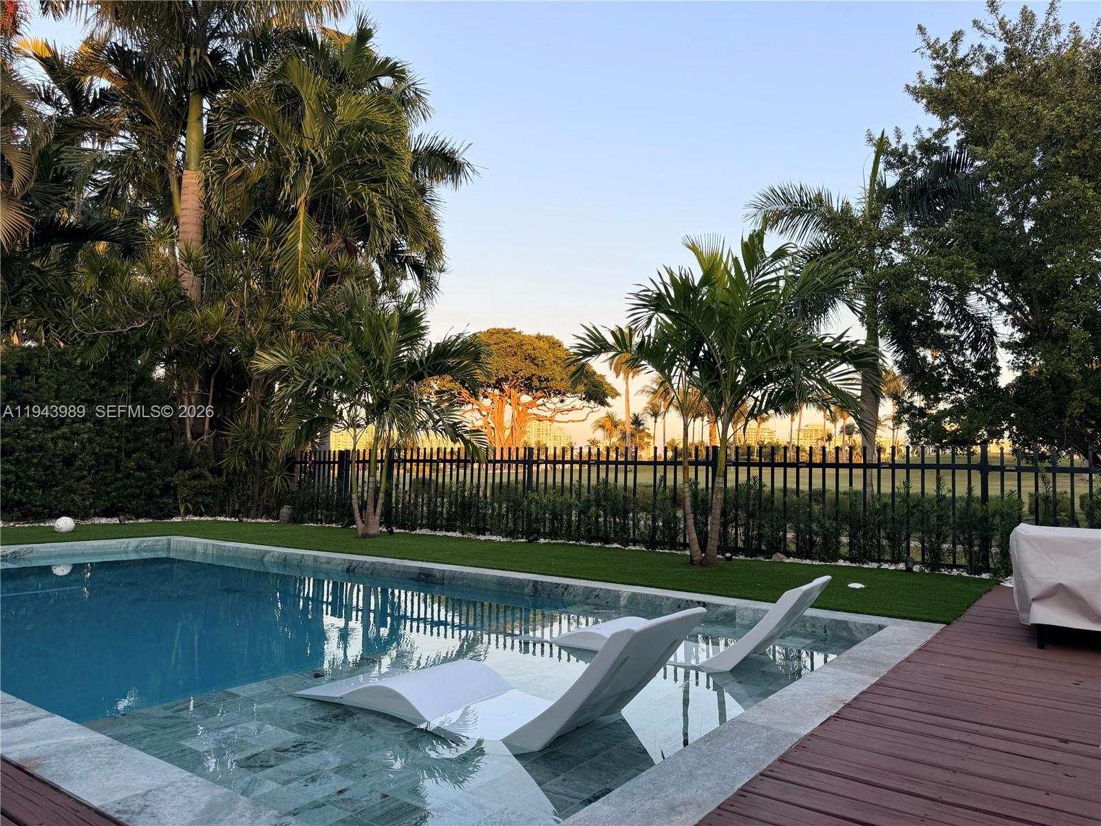 Prime location just one mile from the beach, this fully renovated 4BR/4BA residence sits directly on the prestigious La Gorce Country Club Golf Course with stunning, unobstructed golf views. Gated entry and designer finishes throughout.

Bright, open living spaces with a split floor plan, circular driveway, impact windows and doors, and a sleek modern kitchen featuring custom wood cabinetry, stainless steel appliances, gas stove, and bar seating. Spacious bedrooms offer comfort and privacy.

The primary suite showcases sweeping golf course views and a generous walk-in closet. The family room opens to a beautifully finished backyard with a brand-new pool and wood deck, creating a true indoor-outdoor lifestyle perfect for entertaining.

Private electric vehicle supercharger included.