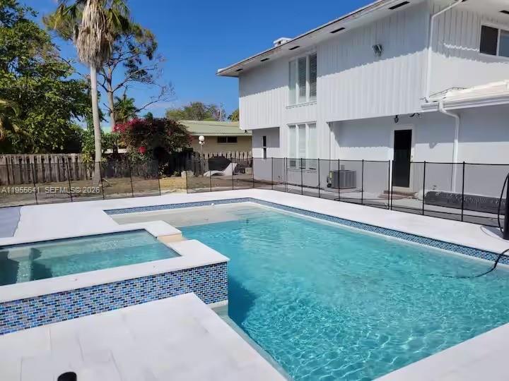 Stunning modern home featuring 5 bedrooms and 4 bathrooms, set on an oversized 13,000-square-foot lot in the heart of Deerfield Beach, just south of Boca Raton. This fully remodeled residence offers a brand-new pool and jacuzzi, a massive private backyard, and sleek porcelain flooring throughout. The gourmet kitchen is equipped with stainless steel appliances and designed for both style and functionality. Offered fully furnished—just bring your toothbrush—this turnkey home is move-in ready. Located just over 1.5 miles from the beach, Deerfield Beach is a dreamy coastal neighborhood known for its laid-back vibe and classic Old Florida beachfront charm, blending relaxed seaside living with easy access to dining, shopping, and entertainment. This is Florida living at its finest.