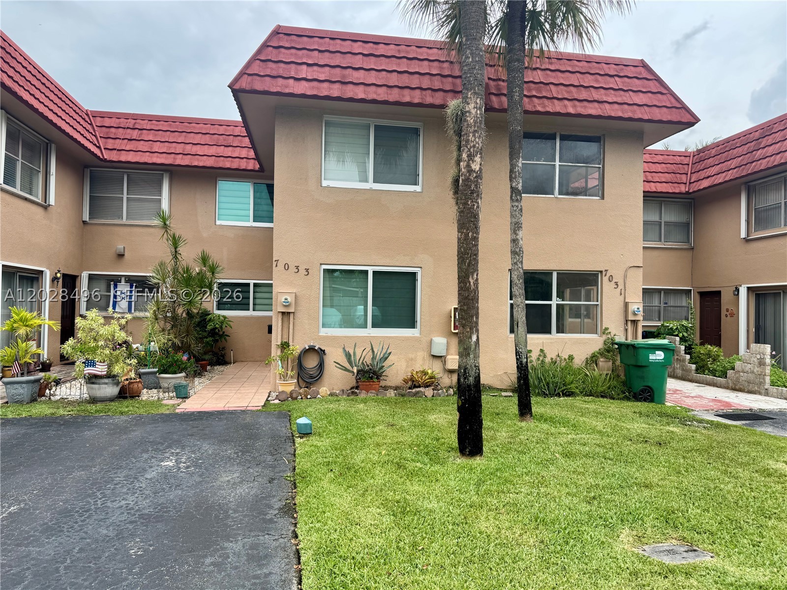 Nice house! 4 Badroom, 2.5 baths Townhouse ,  one bedroom and 1/2 located on the first floor, impact windows , roof are 8 yrs  old, patio and canal, parking for 3 cars. Property  has  tankless water heater. Larges  screen aluminum enclosed patio and small yard and the canal view.