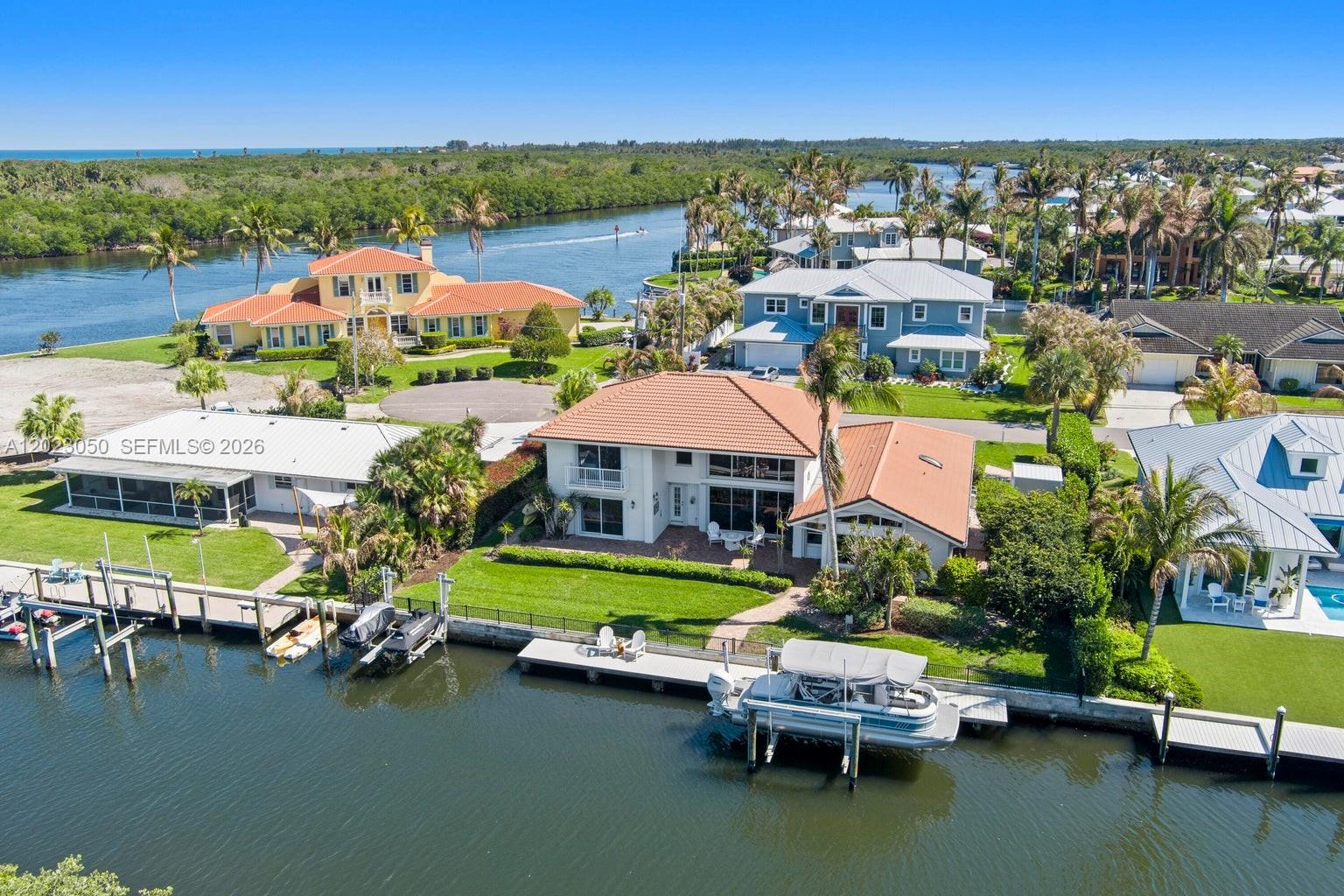 Waterfront should feel private.

Set along a rare stretch of canal with no homes directly across from you, this Hobe Sound residence offers the kind of discretion, boating access, and quiet luxury that has become increasingly difficult to find in South Florida. Private dockage, effortless Intracoastal access, and a refined coastal setting designed for those who value both lifestyle and privacy. 

A rare waterfront find in Hobe Sound, this remodeled CBS home offers approximately 100 feet of waterfront with an open canal view and no neighbor directly across the water—an uncommon setting that adds privacy, openness, and value. Featuring 4 bedrooms, 3 baths, soaring ceilings, water views, and a first-floor primary suite, the home is designed for easy coastal living. A concrete seawall, dock, boat lift, and jet ski davits support the boating lifestyle, with quick Intracoastal access between the Jupiter and St. Lucie Inlets, access to North Jupiter Island beaches by boat, and the Bahamas within reach. Minutes to Hobe Sound's charming downtown, beaches, dining, golf, Jupiter, and Stuart.