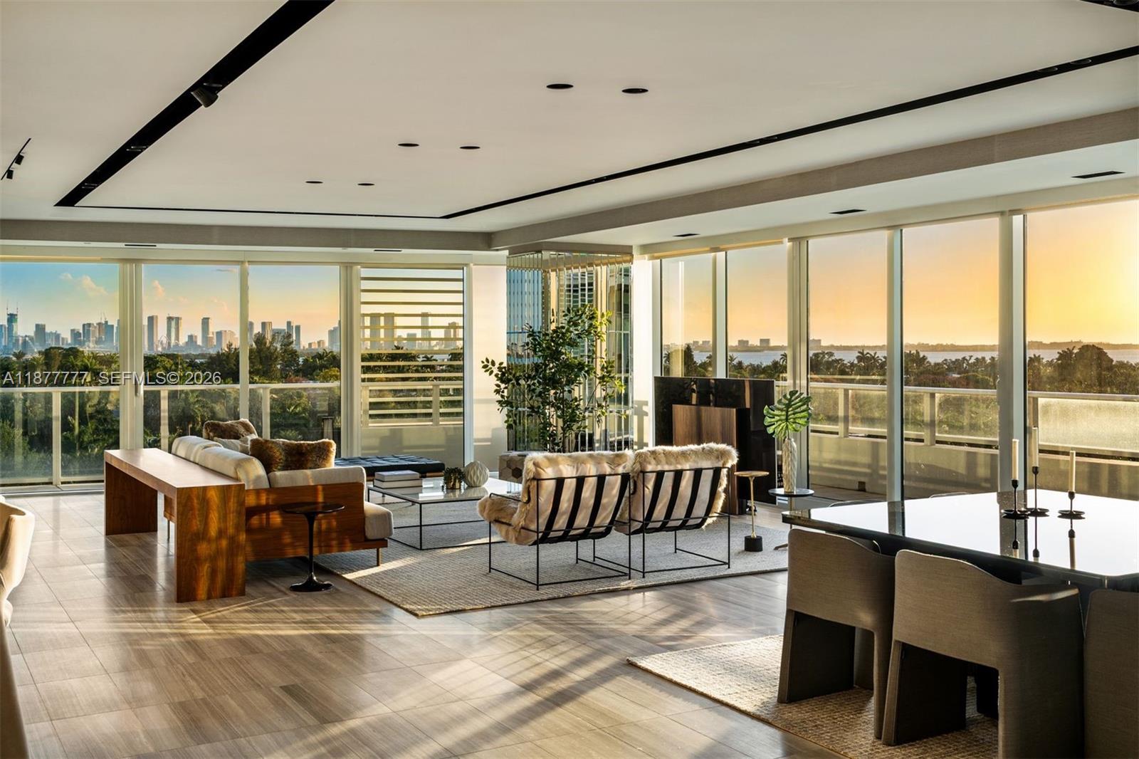 Welcome to an exceptionally rare 4bd, 4.5ba corner unit spanning 4,204 sq ft of refined indoor living. With a private elevator entrance, multiple entertaining areas, and a large media room, this residence feels like a private home. Breathtaking views of the Miami skyline through floor-to-ceiling windows, the expansive layout is ideal for both relaxed living and elevated entertaining. A sleek Boffi kitchen with Gaggenau appliances anchors the open living space, while custom millwork and clean architectural lines echo minimalist design. Oversized primary suite includes spa-inspired bath, 2 walk-in closets, private balcony. Enjoy 5-star Ritz-Carlton amenities with 24-hr concierge and valet service. This serene enclave just minutes from the beach, Sunset Harbour, and Bal Harbour.