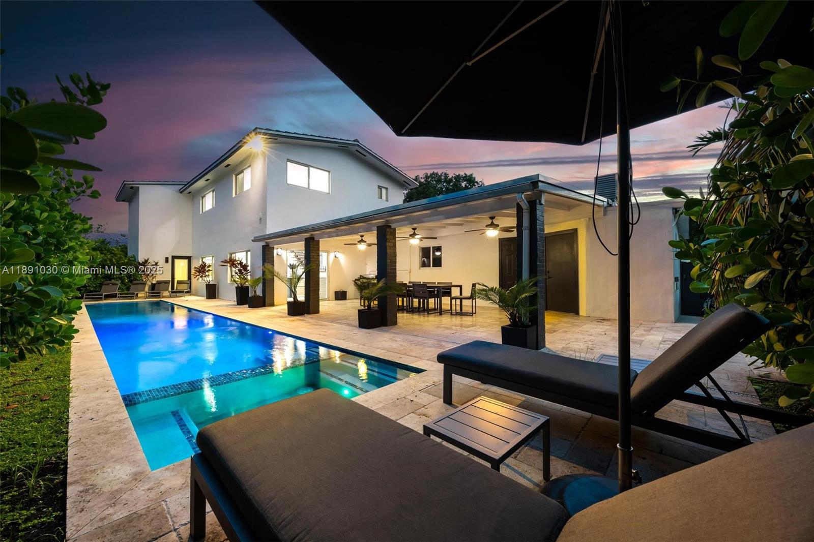 Don’t miss the chance to make this stunning gem in the coveted Roads neighborhood your new home! Ideally situated on an 11,500 SF lot, 5 min from Brickell, 7 to Coconut Grove, 10 to Coral Gables,& 20 to SoBe. This beautifully updated residence features 6 bed/6 bath along w/spacious family room, formal living and dining areas, and a chef’s kitchen. Enjoy the large heated lap pool w/spa, cabana bath w/steam shower, and covered patio—perfect for entertaining. Fully furnished, the home also boasts new flooring remodeled kitchen. The fenced backyard offers privacy and includes mature mango & avocado trees. Ideal for multigenerational living, a separate 2 bed/1 bath suite with private entrance and living/dining area is perfect for guests or extended family.