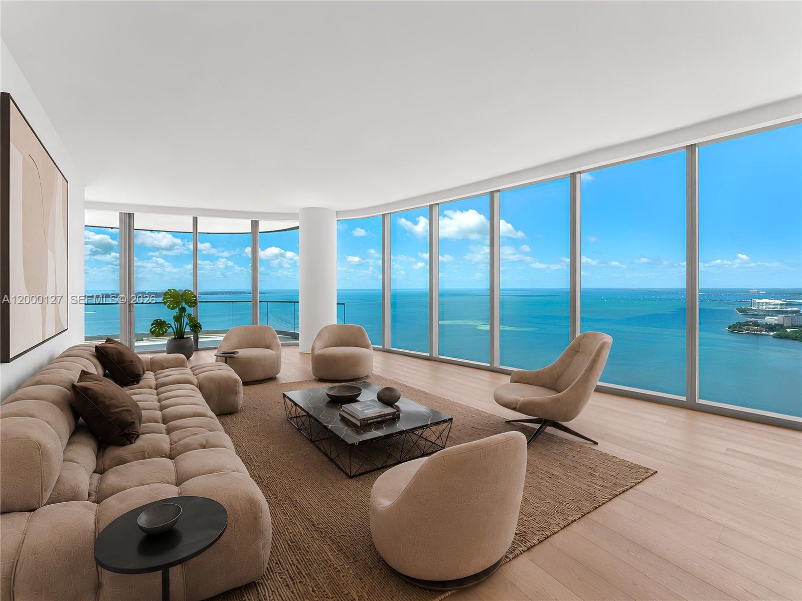 Welcome to the best in waterfront living. Residence 3602 at UNA Residences is not just a home; it is a masterwork of light, water, and architectural precision. Positioned on the highly coveted Southeast Premier corner, this 36th-floor residence captures the essence of the Miami lifestyle. From the moment your private elevator opens into your personal foyer, you are greeted by the shimmering expanse of Biscayne Bay and the Atlantic Ocean stretching toward the horizon. Designed by Adrian Smith + Gordon Gill Architecture, every inch of this home is inspired by the sleek, organic curves of classic Italian wooden yachts. Featuring 4BRs, 4.5BAs, and a powder room, each space is designed with floor-to-ceiling high-efficiency glass and direct access to outdoor areas. The corner layout offers an open-concept Great Room filled with natural light and showcases 270-degree views of the coastline and South Brickell. A signature 10FT deep outdoor living room with seamless glass railings is designed for effortless entertaining against a backdrop of water & skyline views. The kitchen is outfitted with professional-grade Gaggenau appliances, including an induction cooktop, wine cooler, and integrated custom cabinetry. From 24-hour concierge and valet to dedicated white-glove service, every detail is thoughtfully curated. Residents also enjoy an Aman-inspired spa with indoor & outdoor treatment rooms, steam and sauna, and a state-of-the-art fitness center with yoga & personal training studios.