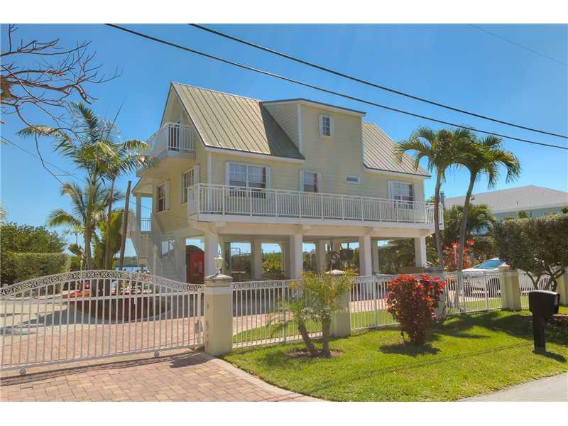 BAYFRONT GEM-- Pool home in Buccaneer Point Estates. Private dock with ramp & dock. Bay views with access to Ocean. Metal roof, bamboo flooring, granite counters, stainless steel appliances & marble in baths.Pool has a spill over spa at the water's edge.