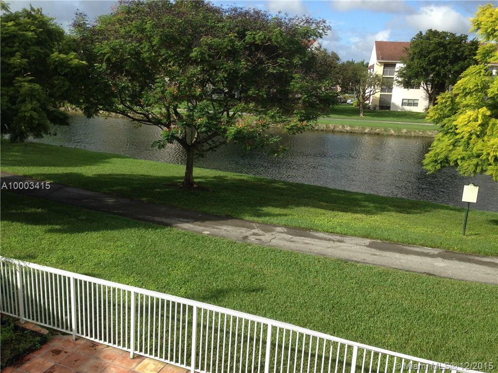 Spacios home on a wide canal in sought after Jasmine at the Hammocks. Great view of the wide canal from the
home & the tiled loggia/patio. Very nice community with good security & a guarded gate. Open floor plan with spacious rooms. Kitchen opens to large eat in family room. Four bedrooms upstairs including large master suite & master bath/spa with a large balcony overlooking canal/lake views. Half bathroom, laundry room, 2 car garage downstairs. This is a great family home at a great price.