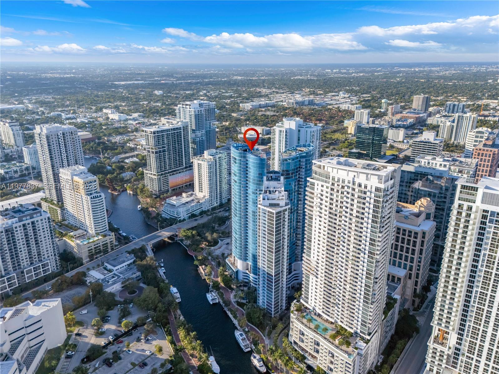 STRATEGICALLY PRICED FOR TODAY'S MARKET— OVER $200K IN UPGRADES—
Turn-key luxury in the heart of the Venice of America. This 2-bed + entertainment ‘s bar, 3-bath residence at Las Olas River House offers over 2,100 sq ft of refined living with floor-to-ceiling glass showcasing sweeping views of the downtown skyline and situated along the New River . A secure fob-access elevator opens to a private foyer leading to a light-filled layout with designer lighting, premium flooring, a gourmet kitchen, an entertainer’s bar area and a completely renovated stunning master bathroom. Residents enjoy a resort-style lifestyle with a heated pool, cabanas, sauna, and a state-of-the-art fitness center overlooking the river. Huizenga Park is just downstairs with a dedicated dog run, perfect for pet lovers. Step outside to the Riverwalk and catch the Water Taxi to enjoy fine restaurants, cafés, and the Broward Center theater without ever needing a car. Concierge, valet, and LauderGO! shuttle service complete this exceptional riverfront living experience.