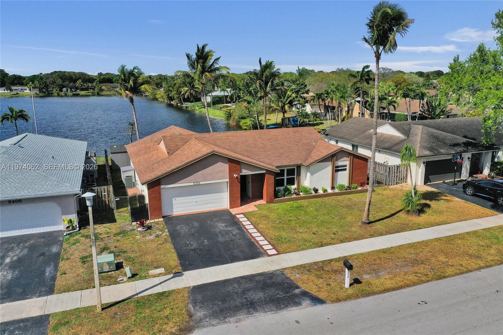 WELCOME HOME TO “SOMEPLACE SPECIAL” COOPER CITY. A SINGLE FAMILY LAKEFRONT POOL HOME IN FLAMINGO GARDENS WITH 3 BEDROOMS AND 2 FULL UPGRADED BATHROOMS WITH A 2 CAR GARAGE ON A LARGE LAKE WAITING FOR A NEW FAMILY TO CALL THEIR OWN. FEATURES INCLUDE, SPLIT FLOOR PLAN, IMPACT WINDOWS, UPGRADED KITCHEN, PRIMARY ENSUITE SEPARATE SHOWER AND JETTER TUB WITH DOUBLE SINKS,  STAINLESS STEEL APPLIANCES, LIVING ROOM, LAMINATE AND TILE FLOORING THROUGH, DINING ROOM AND FAMILY ROOM. NO HOA.  LOCATED IN ALL “A” SCHOOL DISTRICT. CLOSE TO HIGHWAYS, SHOPPING, RESTAURANTS, PARKS, HOSPITALS AND ABOUT 30 MINUTES AWAY FROM BEACHES. DO NOT BLINK…THIS WILL NOT LAST!