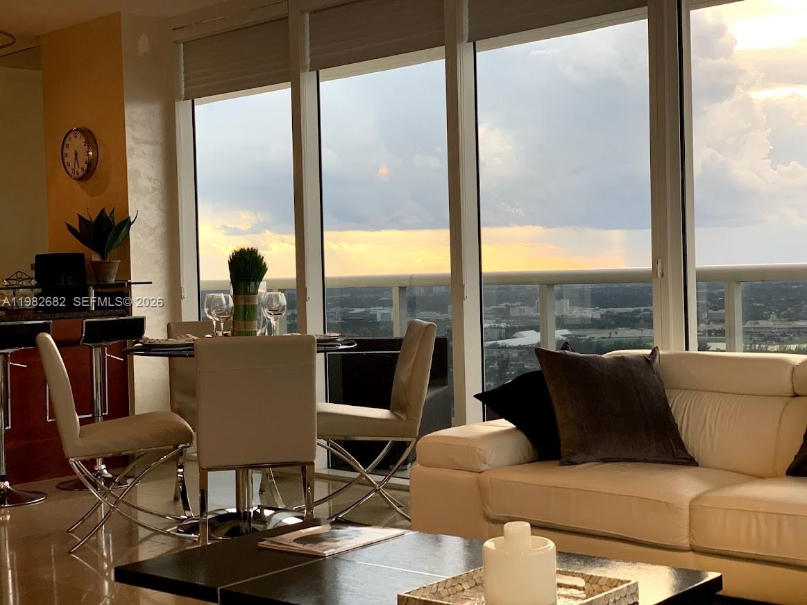 Enjoy the Spectacular views of the Ocean, City, and Intracoastal from the wrap-around huge terrace at floor 46. This corner unit has marble floor throughout entire unit, Italian glass doors, custom lights, window treatments, custom rosewood walking closets, steam shower in the second bathroom in the redesigned toilet, sink and shower. You can also access all the 5 star amenities such as a two-story exercise room, a spa, a sauna, a steam room, 3 pools, bar with pool service, and 24 hour concierge and valet parking. This unit can be rented 12 times per year, with a minimum rental period of 30 days, this makes the property very attractive for investors, especially with the upcoming World Cup in the US.