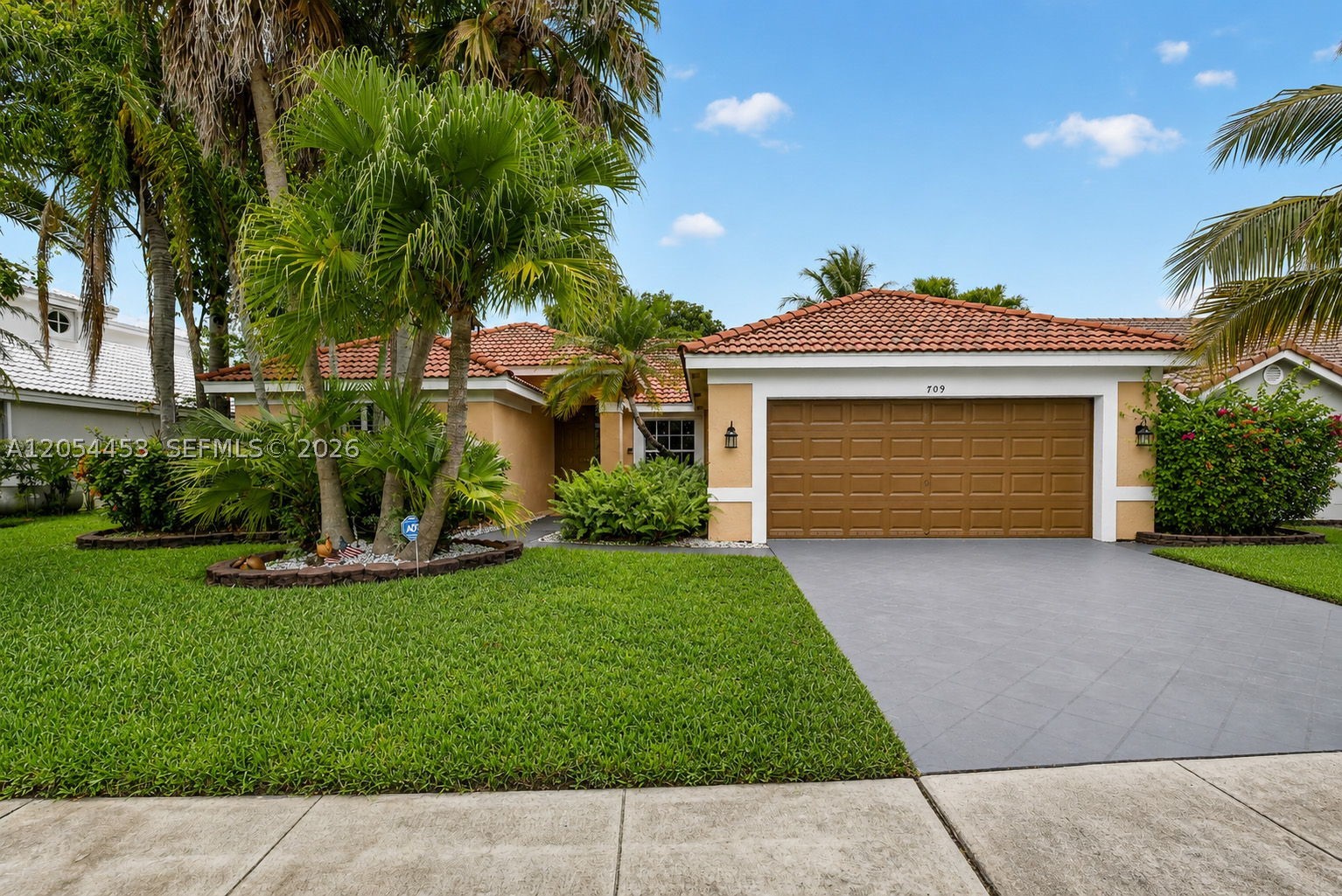 Welcome to this spacious 3-bedroom, 2-bathroom single-family home in the highly desirable Silver Lakes community of Pembroke Pines. Vaulted ceilings and an open layout create an inviting atmosphere, with separate living and family rooms that provide plenty of space for everyday living and entertaining. Large sliding glass doors in both rooms open directly to the covered patio, enhancing the home’s natural light and creating seamless indoor-outdoor flow. The eat-in kitchen offers a functional, open design with counter seating, a sun-filled dining nook, and a stainless steel appliance package. The oversized primary suite also features direct access to the patio, along with an ensuite bathroom complete with dual vanities, a large soaking tub, and a separate shower. Step outside to a spacious covered patio highlighted by beautiful wood ceiling finishes, creating the perfect setting for outdoor dining, relaxing, and entertaining. The fully fenced backyard also features a mature mango tree. Additional highlights include a full laundry room with direct access to the two-car garage, along with accordion shutters for added convenience and peace of mind. Silver Lakes residents enjoy access to community amenities including a swimming pool, clubhouse, and lakeside volleyball court.
