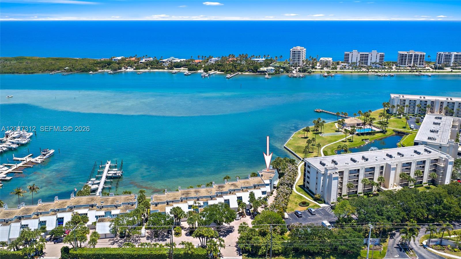 19932 Scrimshaw Way offers a private boat slip and some of the most breathtaking views in all of Tequesta, overlooking Jupiter's famous Bahamian blue water with an incredible wide-water setting rarely found at this price point. Positioned on the furthest south end of the development, this rare end unit captures exceptional privacy along with the longest, most dramatic Intracoastal views in the community. Beautifully kept and meticulously maintained, this is one of those rare opportunities where you can move right in and immediately enjoy the waterfront lifestyle. The spacious primary suite is perfectly positioned to take in the phenomenal blue water views straight from the bedroom, creating an incredible backdrop to everyday living. Located in the heart of Tequesta, you are just moments