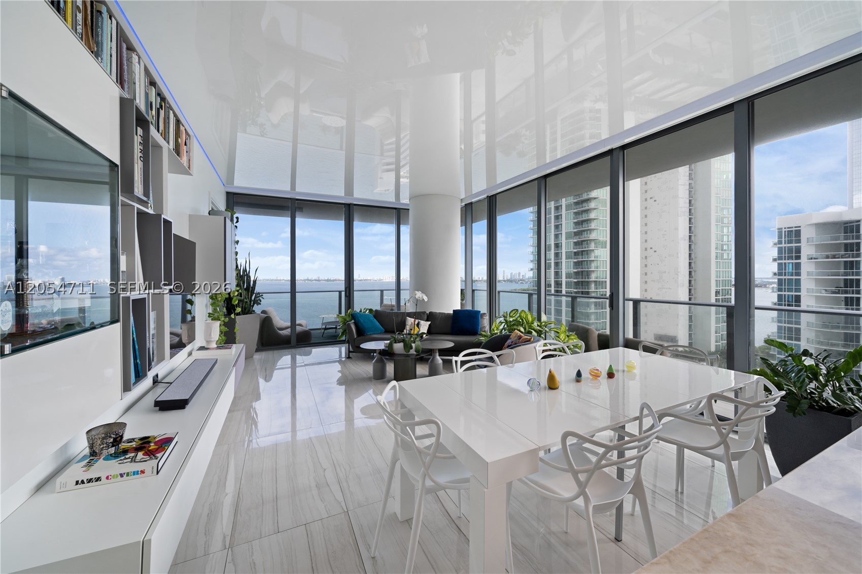 Introducing a truly magnificent and elegant corner unit at Gran Paraiso, offering breathtaking bay and ocean views, complemented by the enchanting cityscape at night. This 4-bedroom, 4.5-bathroom haven boasts wraparound terraces, floor-to-ceiling windows, inviting natural light, and panoramic views. With arrival via private elevator access to 10 foot high ceilings and an open concept floor plan, this residence exudes an air of spaciousness and sophistication. The beautiful Italian kitchen design features high-end appliances including a Sub-Zero refrigerator and velum ceiling with parameter lights. Resort lifestyle, with access to a spa, state-of-the-art fitness center, bowling alley, tennis court, putting green, and multiple pools.