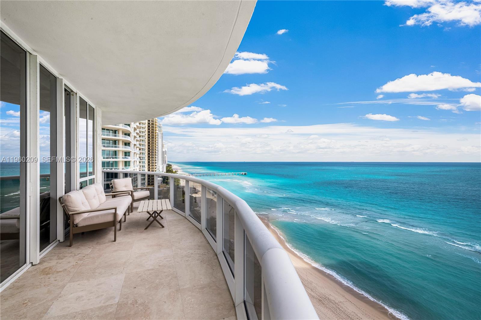 Experience elevated living in this 2,768 SF residence featuring unobstructed ocean views from every room. Recently transformed by a $400,000 remodel, the home boasts marble flooring, fully remodeled master bathroom, a chef's kitchen with Opus Stone counter tops and brand new Wolf appliances, and three en-suite bedrooms. Enjoy a private elevator, four parking spaces (2 titled + 2 valet), and elite amenities including a pool, spa, fitness center, and beach service. With 24-hour security and a new tennis center coming soon, this is the pinnacle of full-service beachfront luxury.