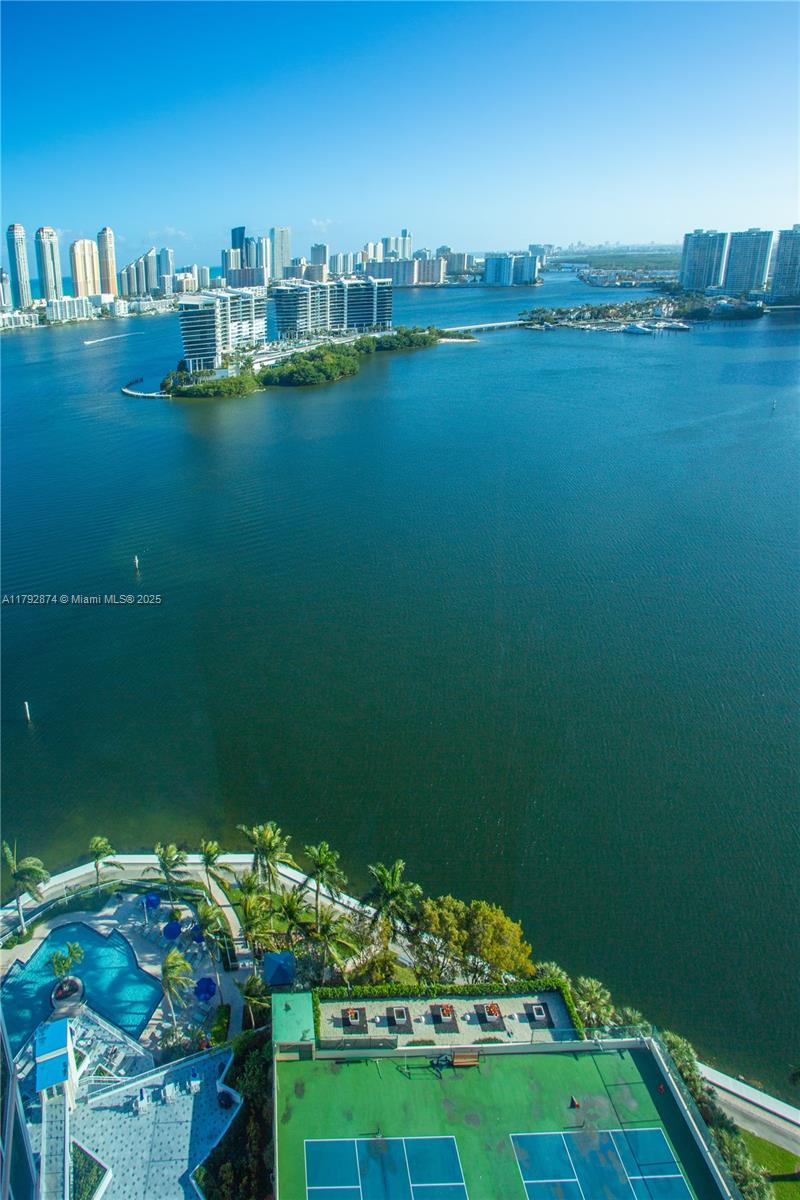 This spacious 2/2.5 1600sq ft unit at Hidden Bay provides an open layout with stunning views of the city skyline, ocean & Intracoastal, through floor-to-ceiling windows. Amenities include a clubhouse & spa, two swimming pools, four tennis courts, a party room & a marina mooring up to 65-foot yachts. Private and secure, the complex sits on 24 acres of landscaped grounds surrounded on two sides by water. Enjoy walking on the grounds and around the marina. Enjoy walking on the grounds & around the marina, Aventura Mall, Founders Park, and the best restaurants & schools are just minutes away...