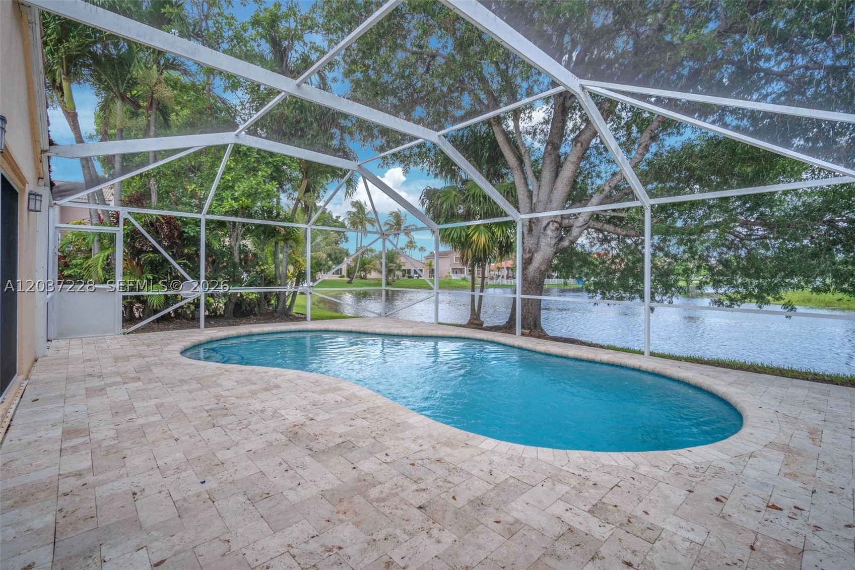 Welcome to the absolute best value in West Pembroke Pines. This bright and airy home delivers over 1,650 square feet of functional living space and stands out as one of the lowest priced single-family pool / waterfront homes in the entire area. It is priced directly below market, offering an incredible opportunity to secure instant equity in a prime location.

Step inside to find a freshly painted interior with tile flooring running seamlessly throughout the entire home, creating a clean, modern look with zero carpet to worry about. The spacious layout maximizes natural light, leading you straight toward your private outdoor oasis. Out back, the screened-in patio features a pool perfect for cooling off, all while framing beautiful, peaceful lake views. Whether you are hosting a weekend barbecue or watching the sunrise over the water, this backyard is built for the South Florida lifestyle.

Complete with a spacious two car garage opportunities like this do not last long. Estancia is a guard-gated private community that is conveniently located near golf, schools, hospitals, parks, restaurants, and shopping.
