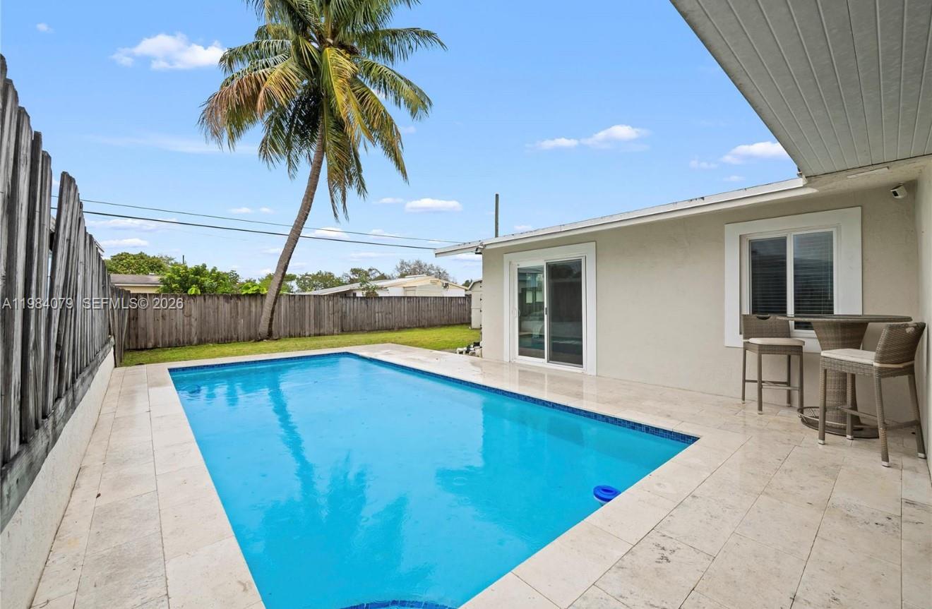 Beautifully remodeled 2 bedroom, 1 bathroom pool home in the heart of Davie, offering the perfect blend of modern design and South Florida living. Situated on a fully fenced lot, this home features a private pool with elegant travertine decking, ideal for relaxing or entertaining.

Step inside to a bright, open interior with updated flooring, recessed lighting, and impact windows and doors throughout. The upgraded kitchen is a standout, featuring quartz countertops, stainless steel appliances, double convection oven, wine fridge, and a dedicated bar area that flows seamlessly into a spacious dining room.

Enjoy the convenience of modern indoor washer and dryer, two covered patio areas, and a large storage shed for additional space.

Located just steps from Davie Veterans Park and minutes from Nova Southeastern University, FAU, Broward College, Hard Rock Casino, shopping, dining, and major highways. Deposit includes 1st month, last month, and security.