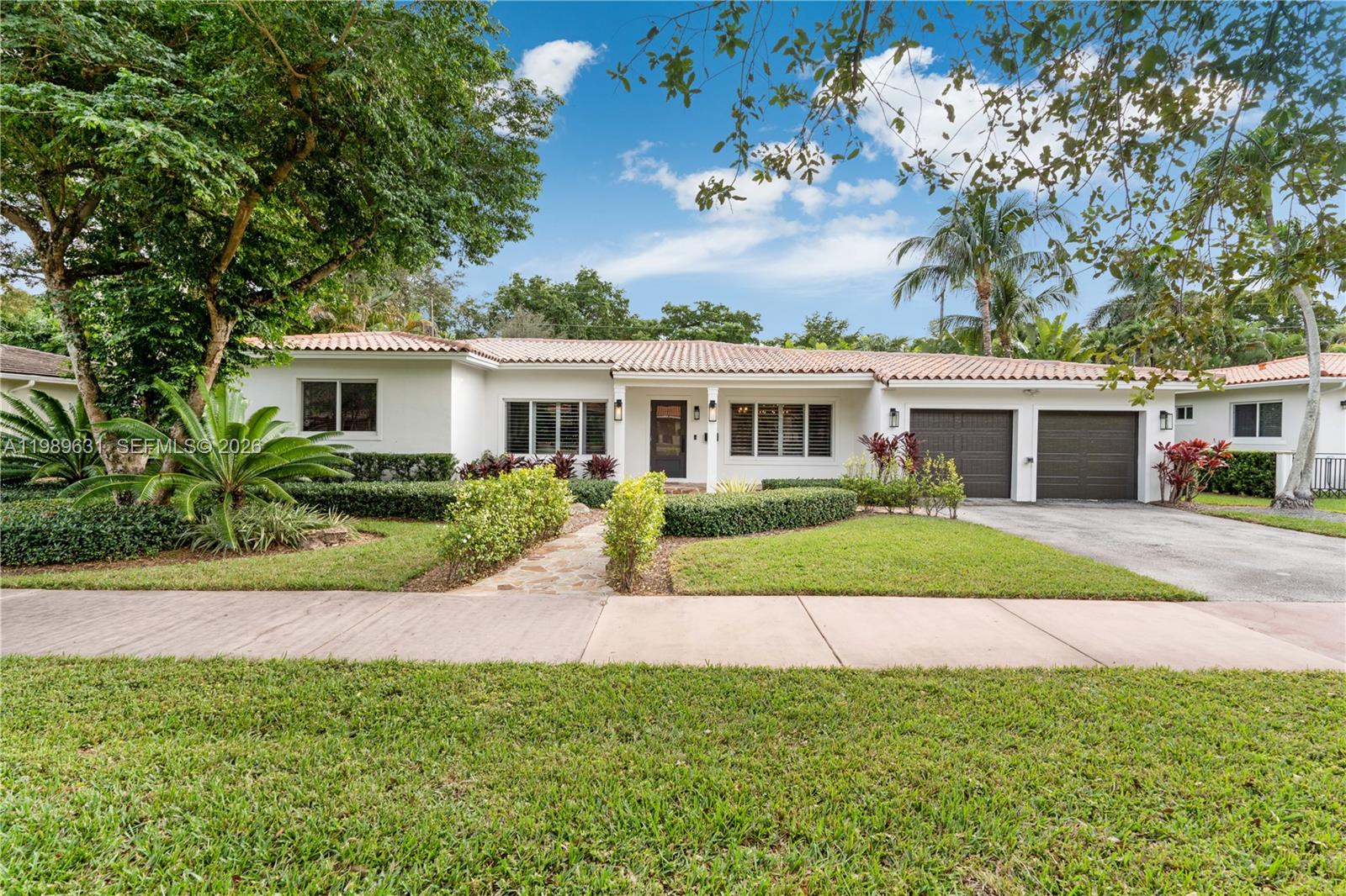 Magazine quality designed house in prime South Gables location renovated in 2021 with tall vaulted ceilings, an open split floor plan and a huge master suite (expanded in 2014) overlooking a serene and peaceful pool area. This house is perfect for entertaining: the new kitchen has exquisite design including bespoke wood cabinets, a subzero fridge, a gas range and a beautiful quartzite island with lots of storage. Custom bar area with antique mirror and wine fridge and full outdoor summer kitchen. Large size Italian porcelain floors, 2 AC zones, 2 water heaters, impact windows throughout, top of the line double garage doors, new plumbing, new electrical panel and wiring, new drain-field and a gym room. Close to UM, top schools and fine dining.